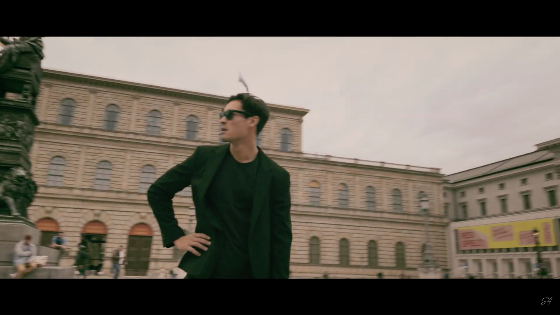 man in black suit outdoors