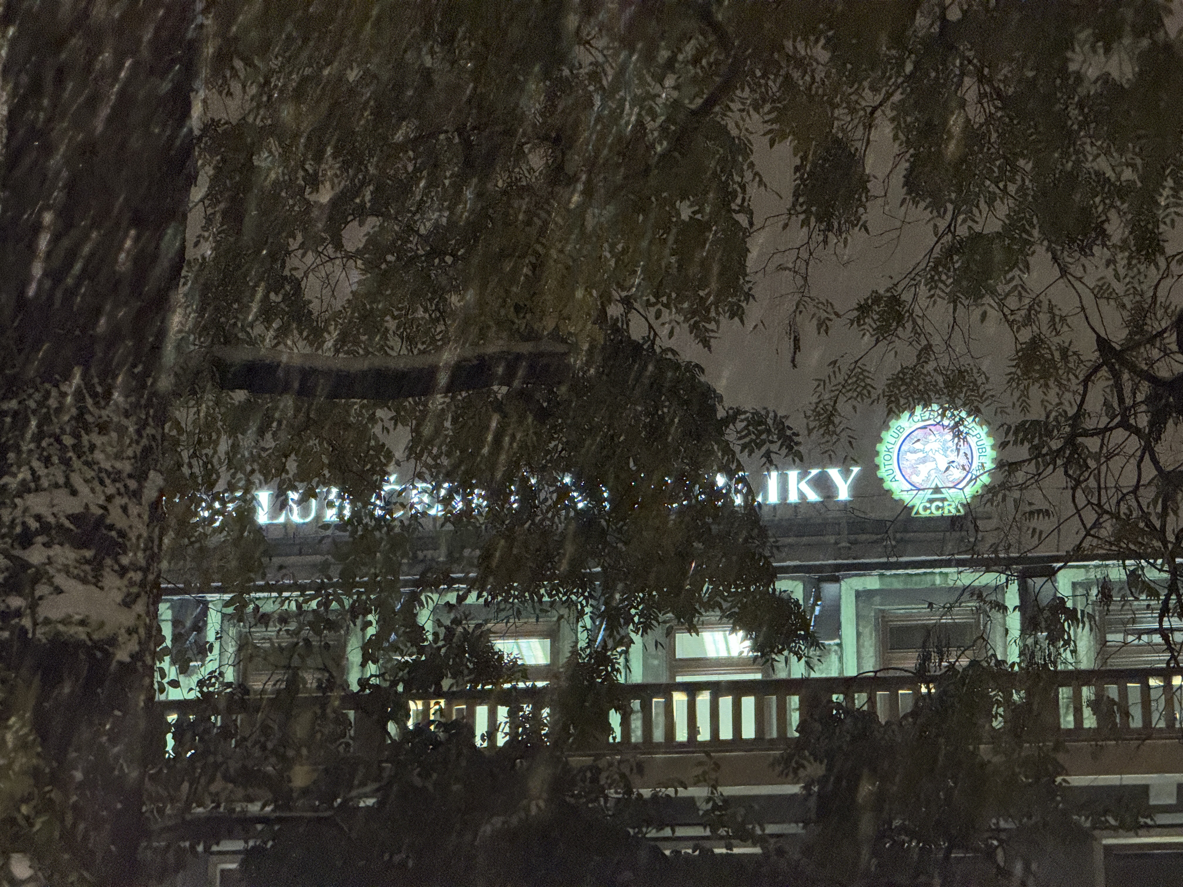 night snowfall building sign