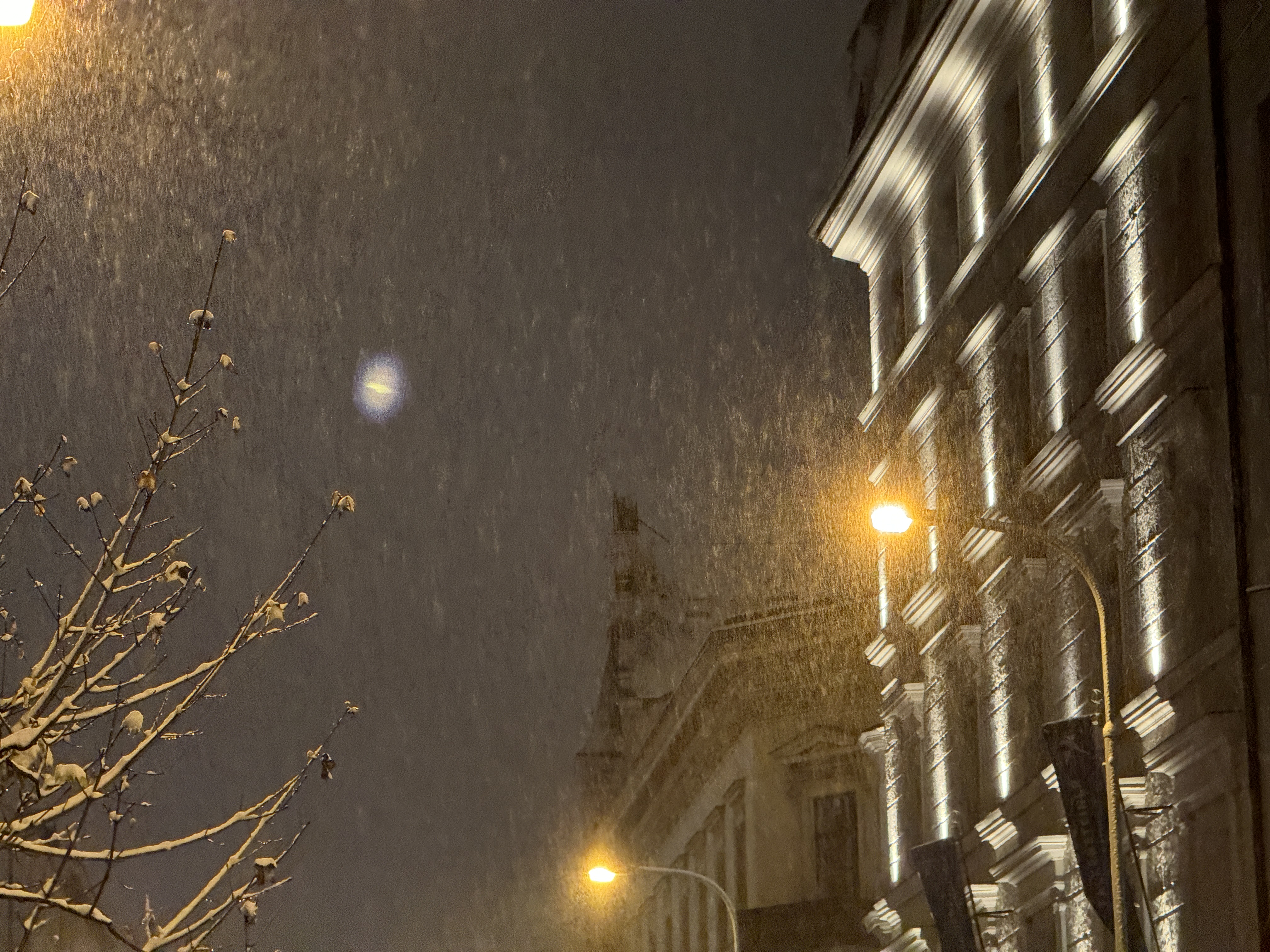 night snowfall street lights