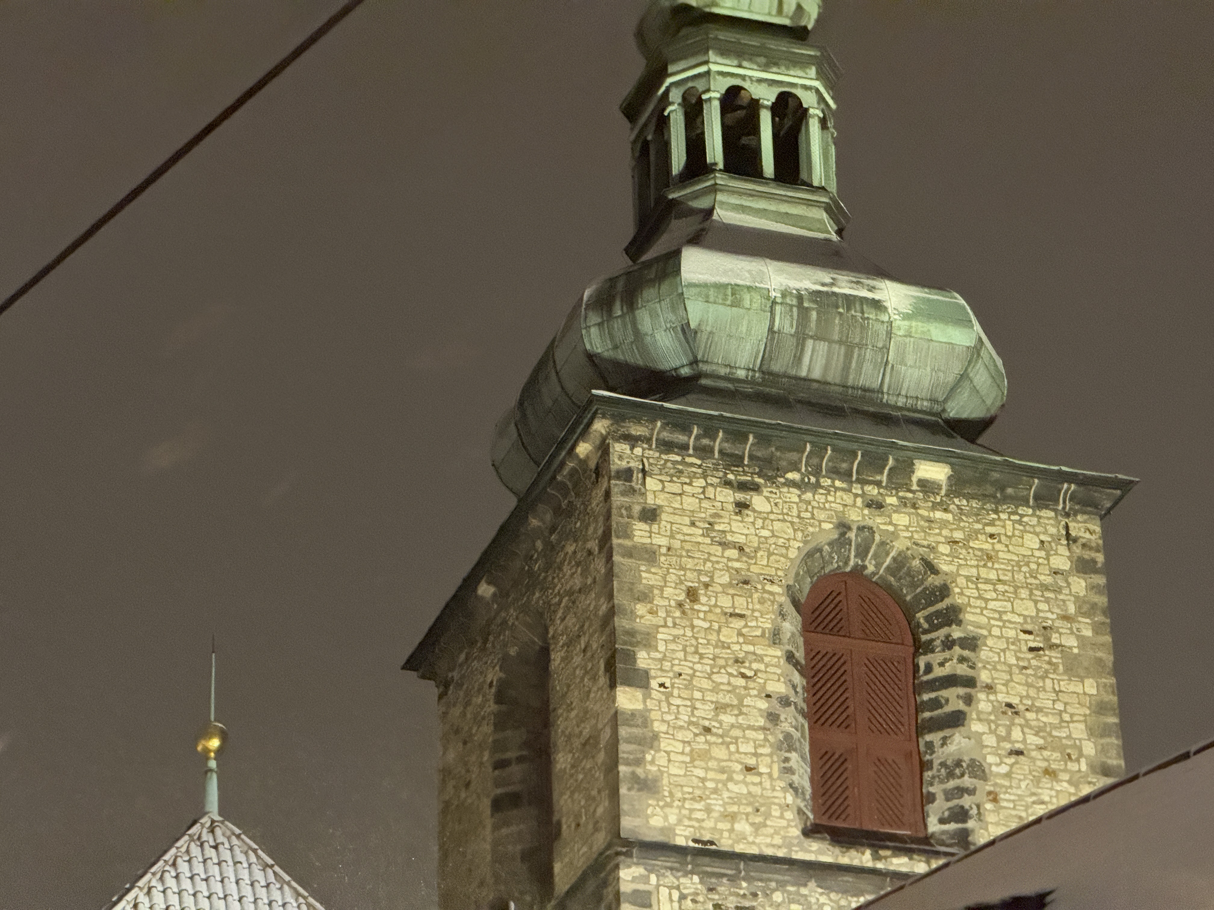 stone tower rooftop night