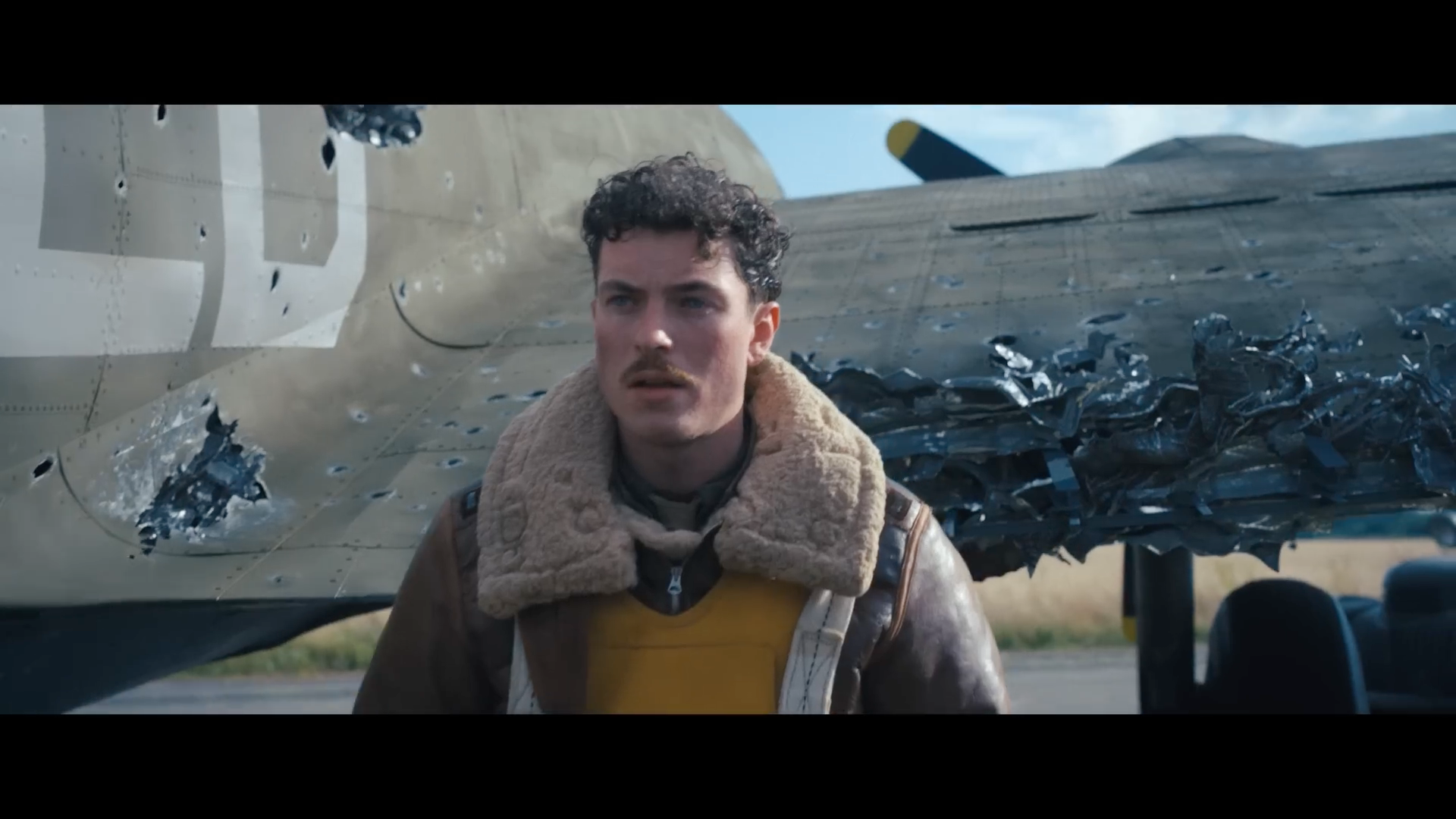 ww2 pilot in front of plane