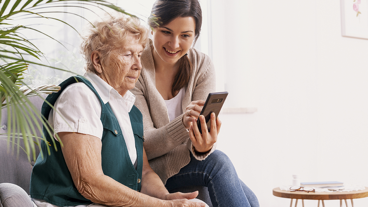 elderly woman with caregiver