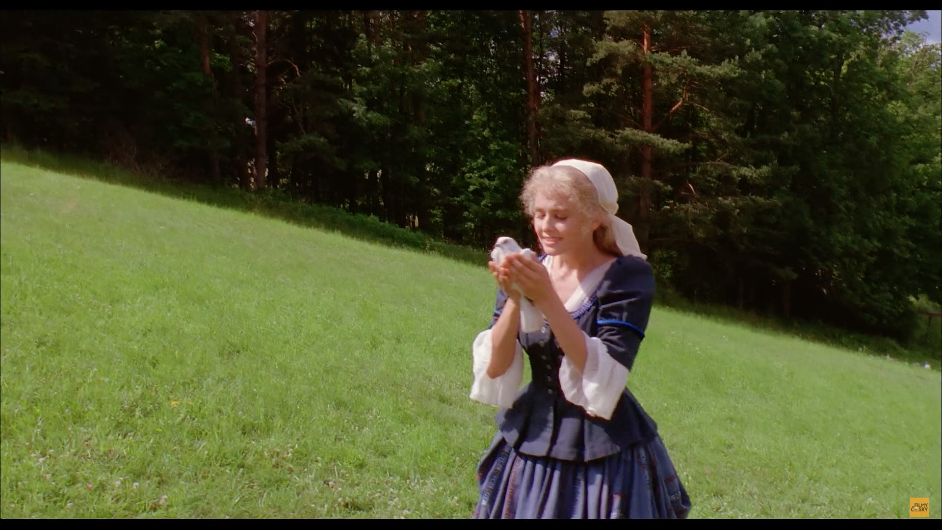 field woman holding bird