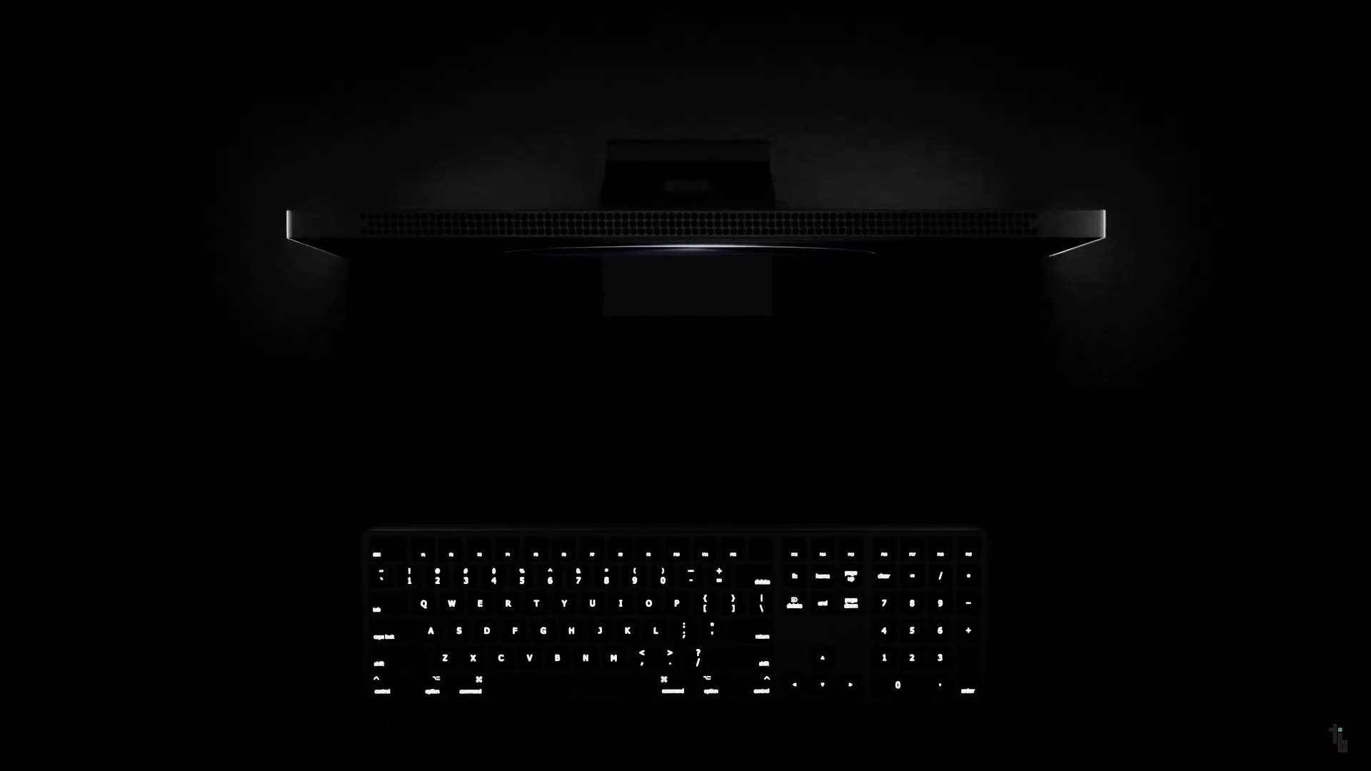 keyboard and monitor in dark