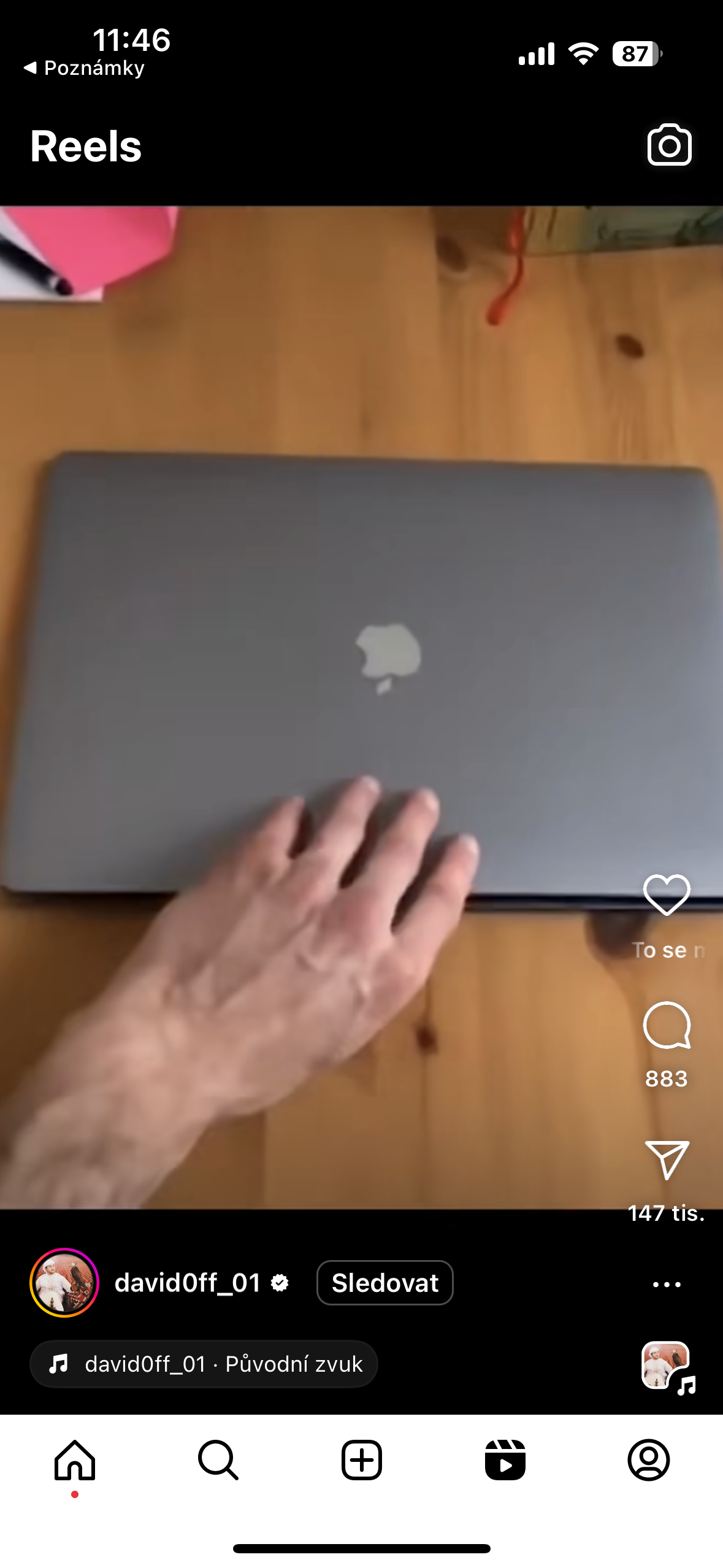 hand closing laptop