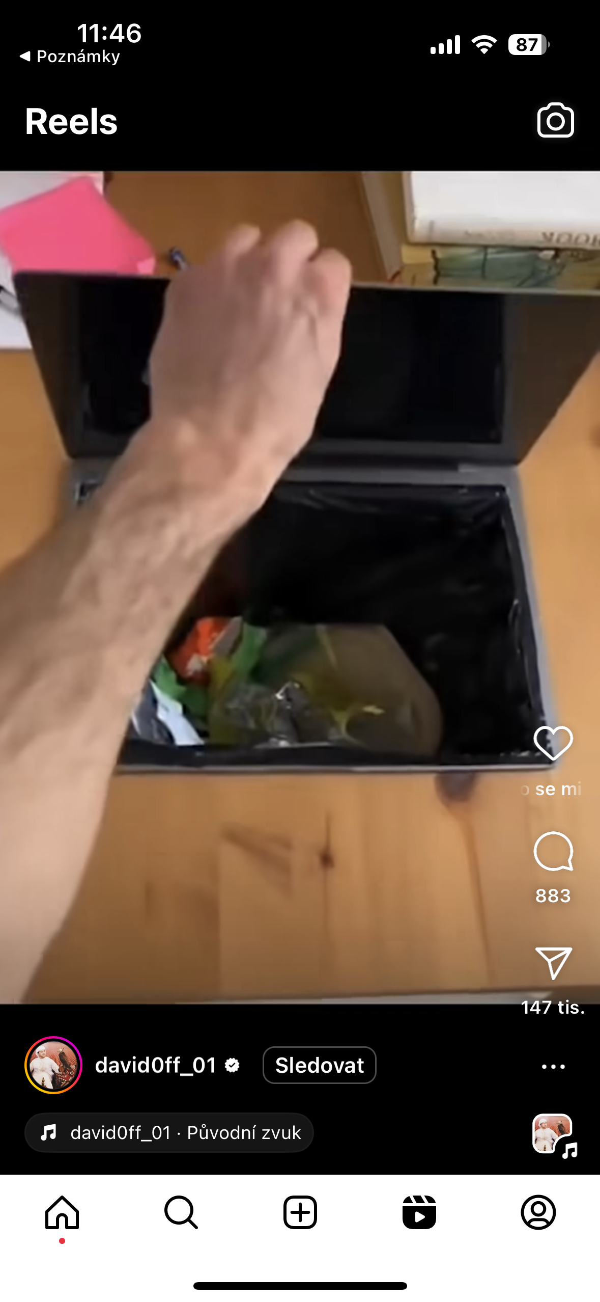 hand opening laptop trash
