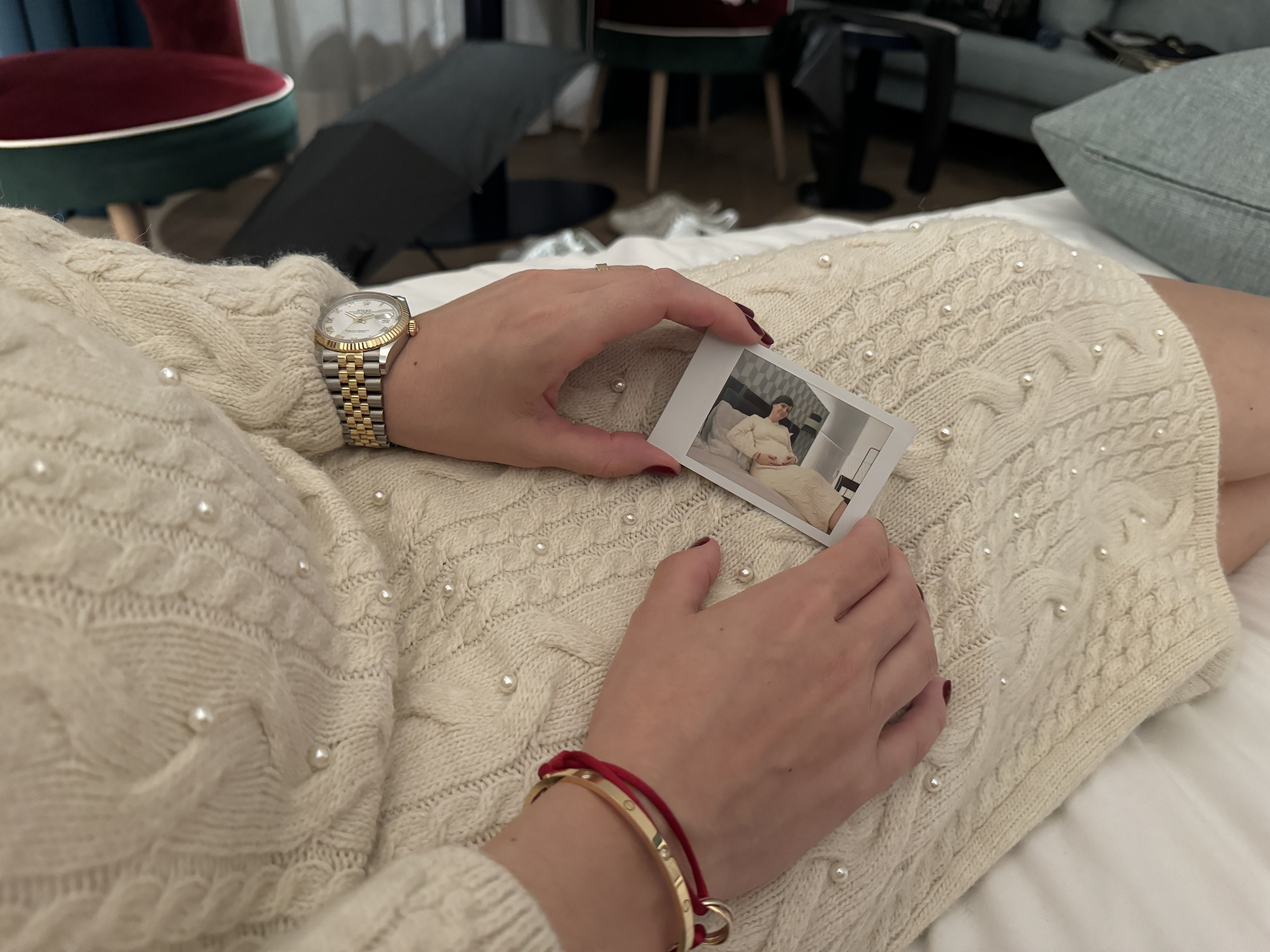 holding polaroid photo