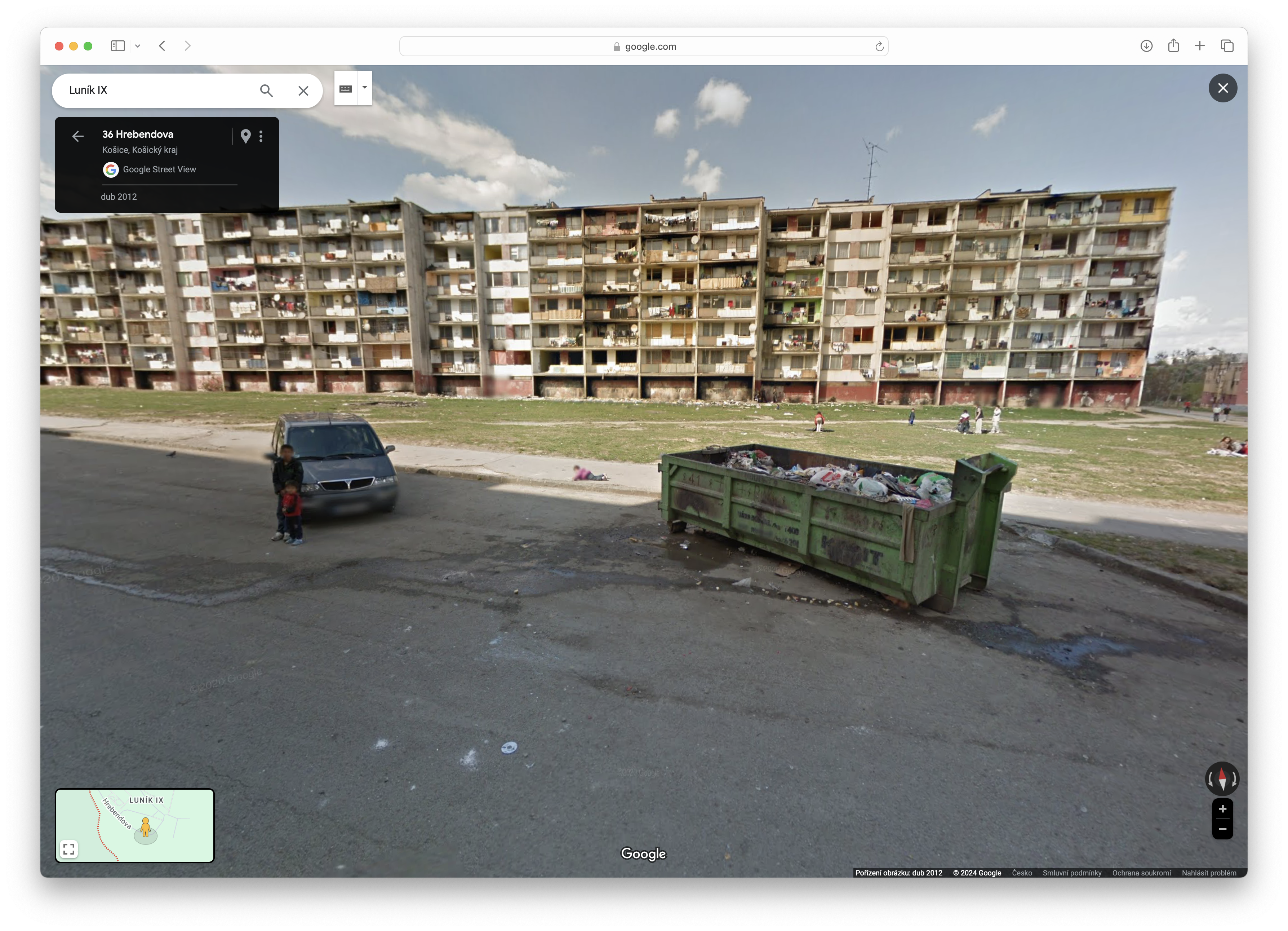 apartment building with dumpster