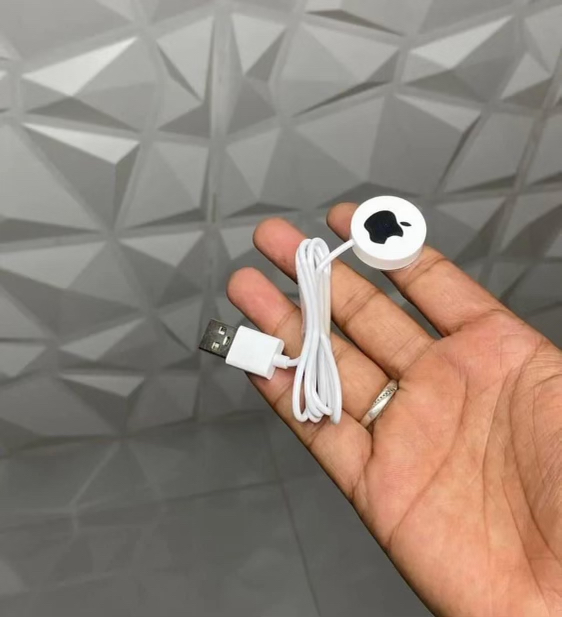 apple charger cable in hand