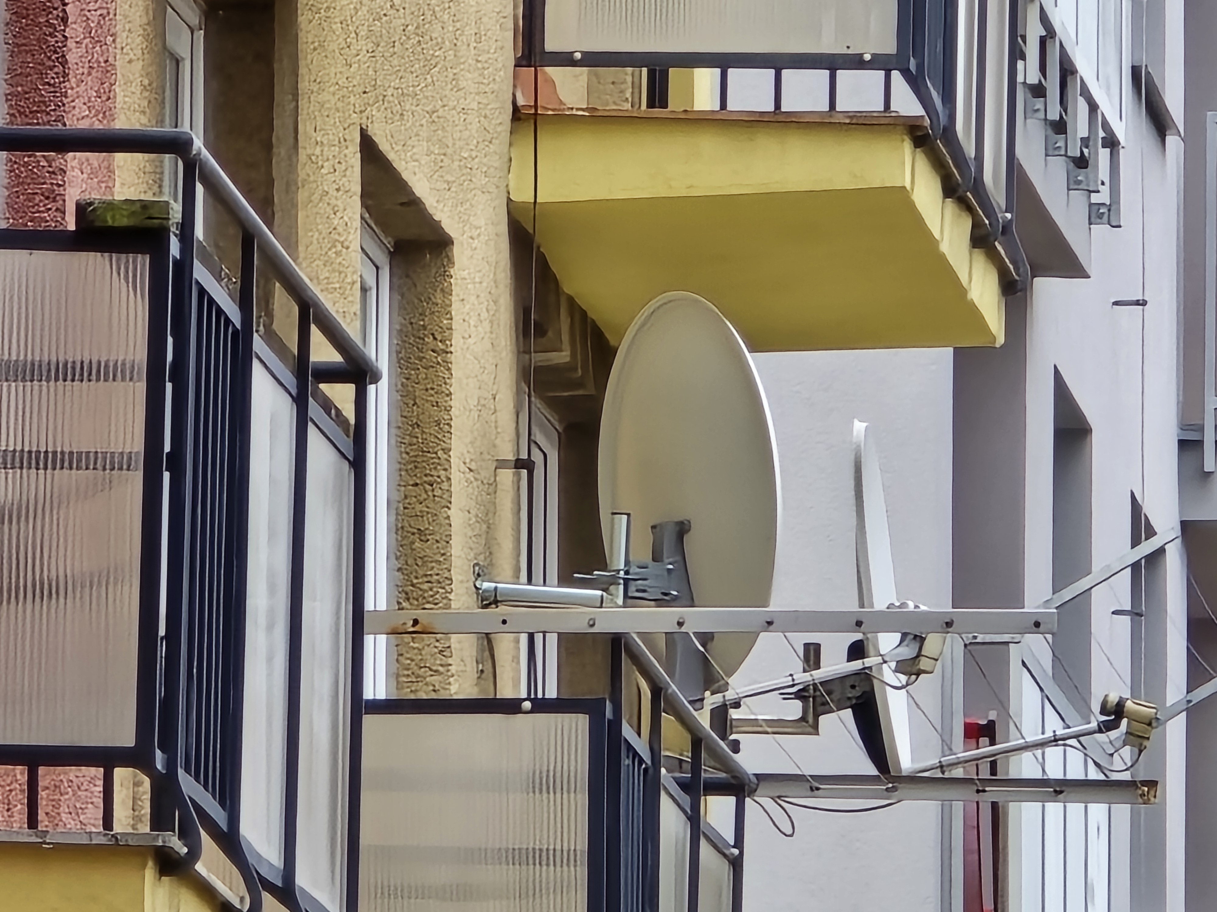 closeup satellite dishes balconies