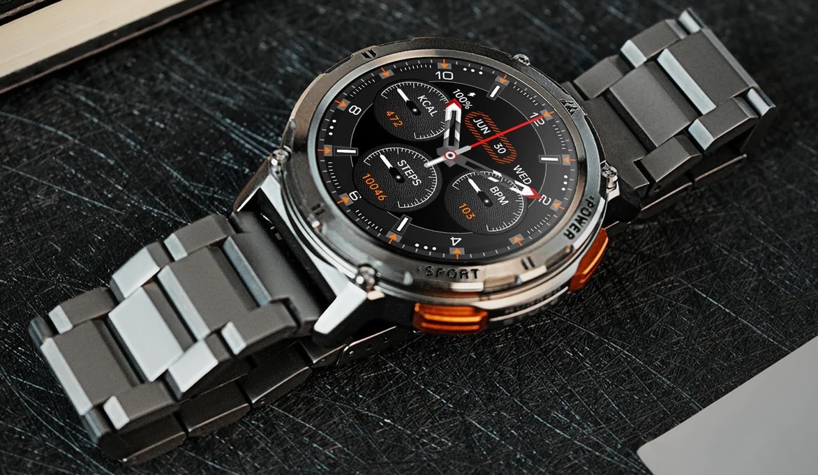 metal wristwatch on table