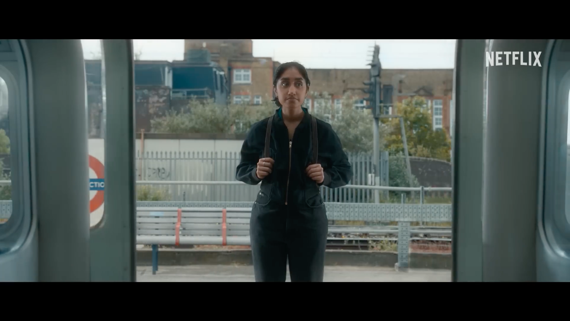 person standing in train doorway