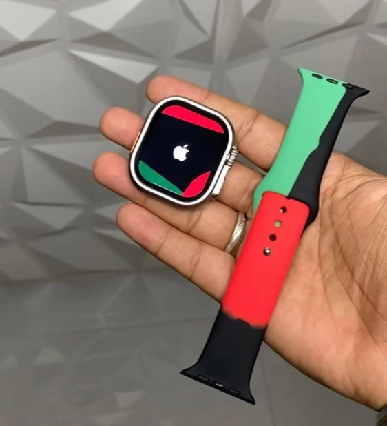 smartwatch and band in hand