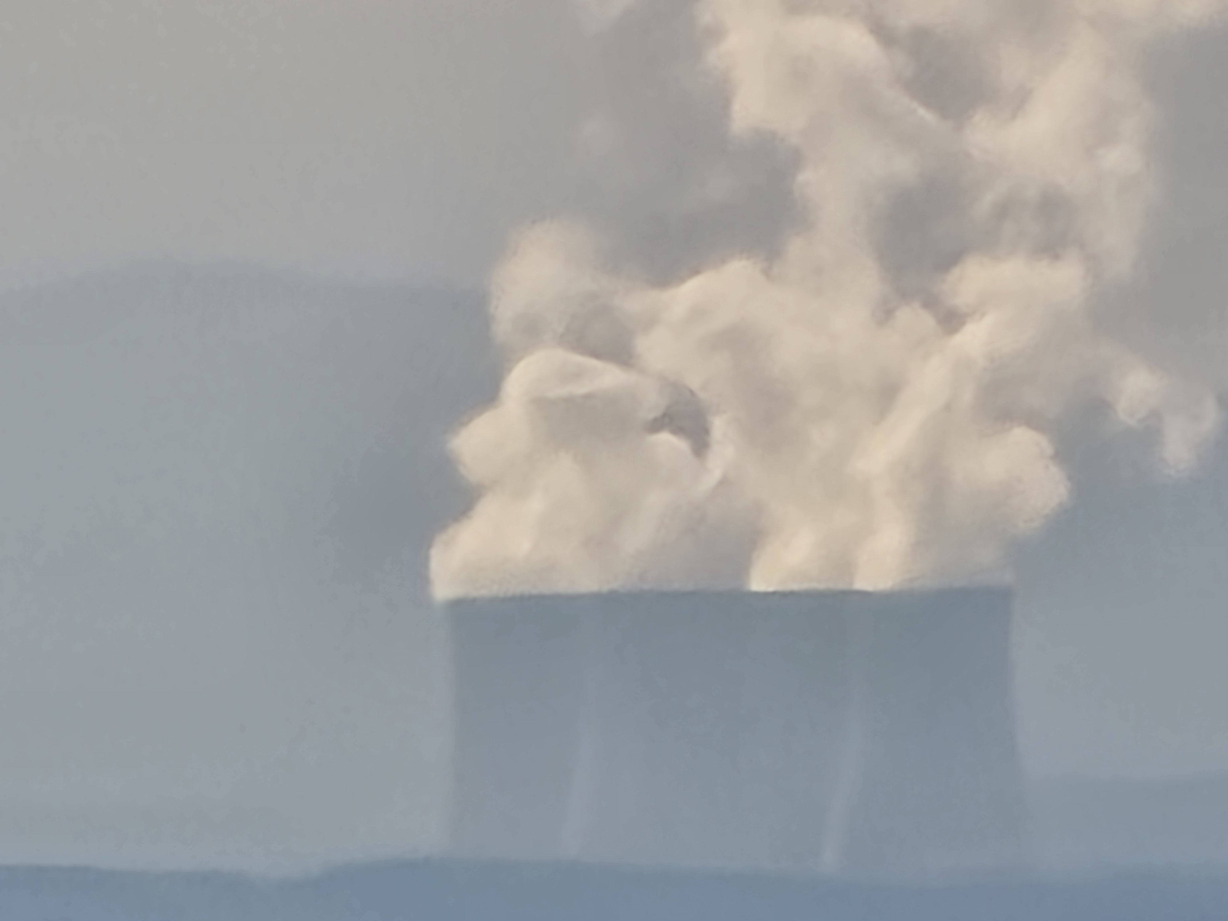 smoke emitting from towers