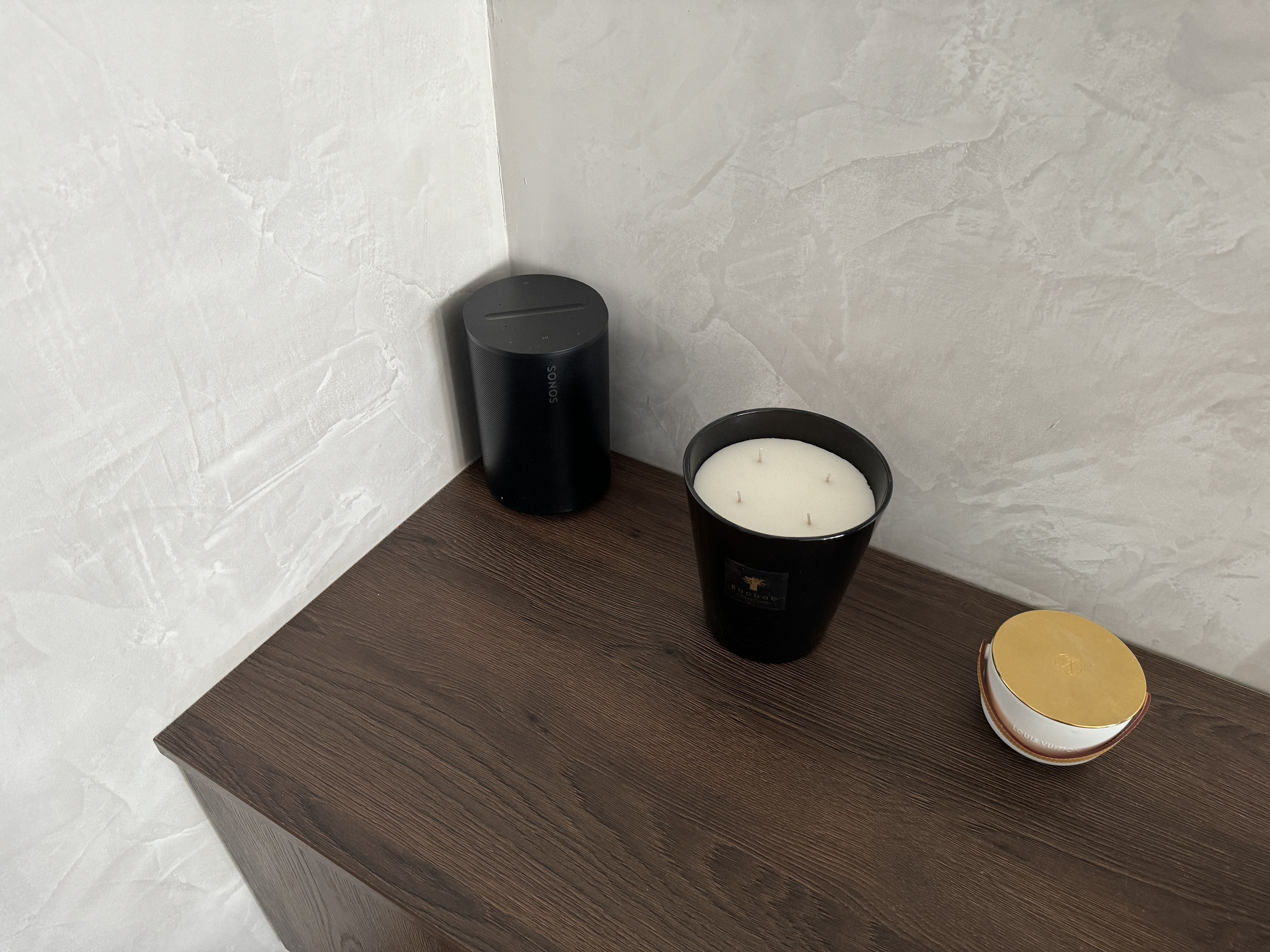 black candles on wooden surface