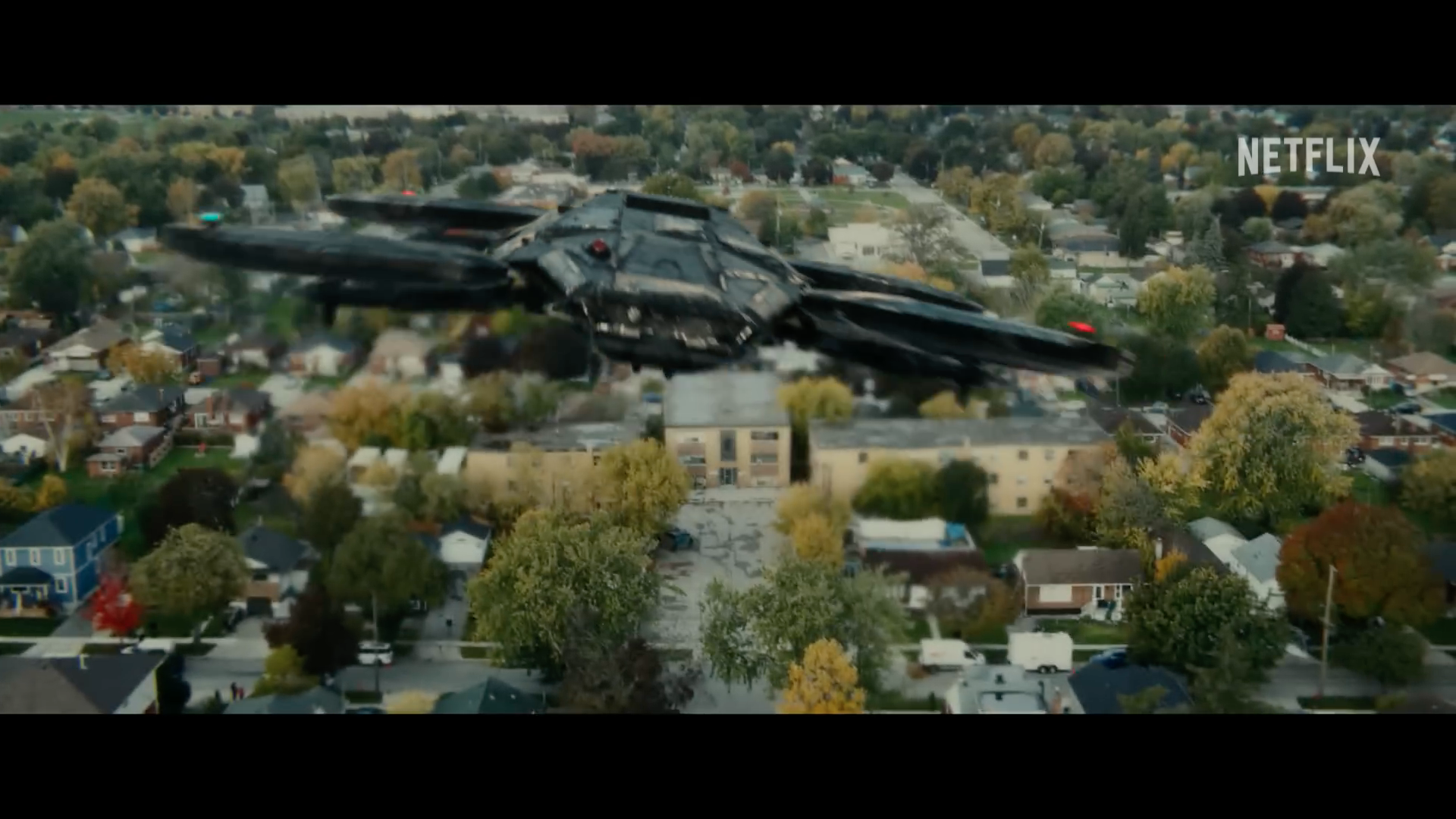 futuristic drone over suburb futuristic drone over suburb