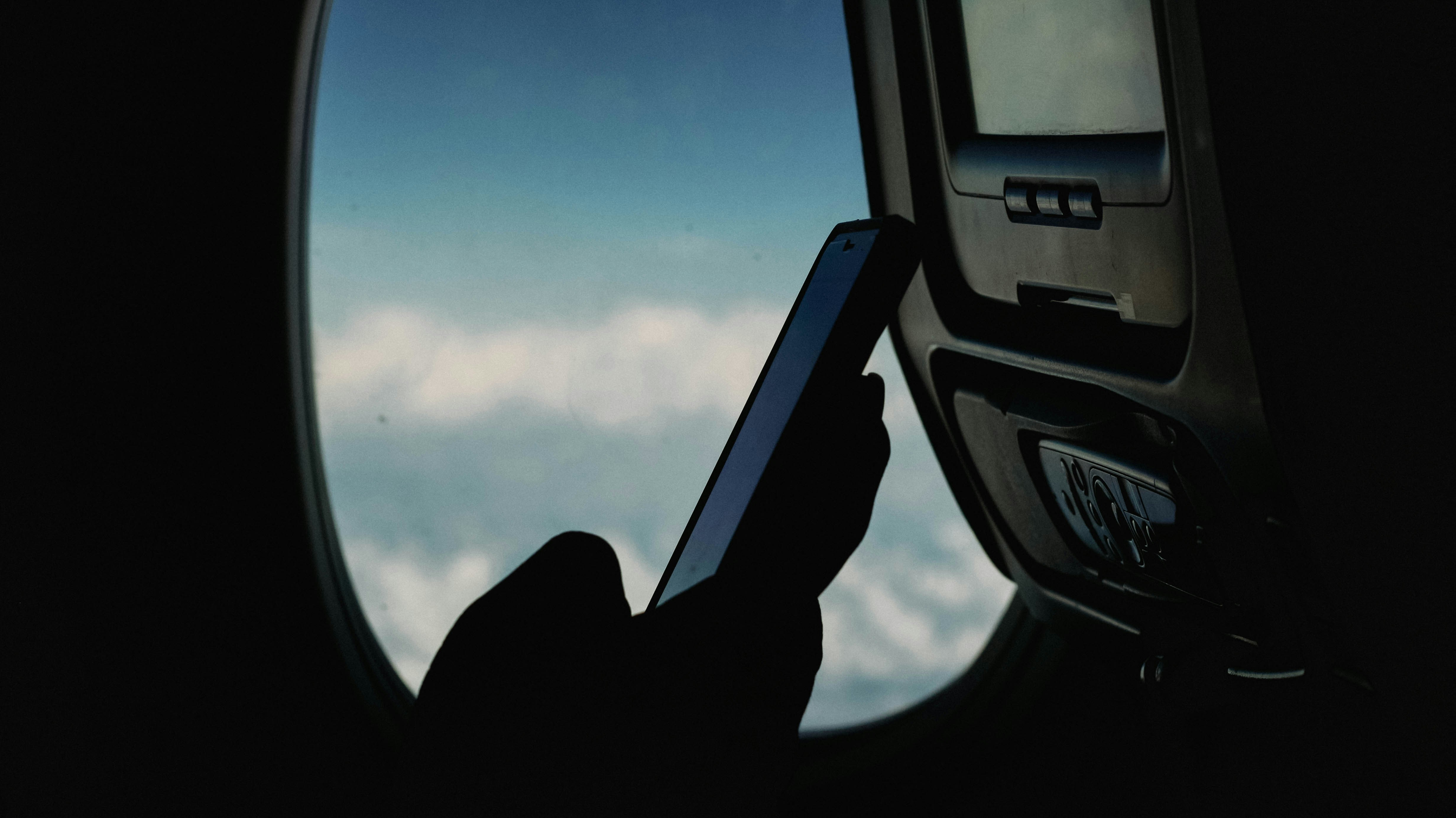 imansyah muhamad putera airplane phone unsplash