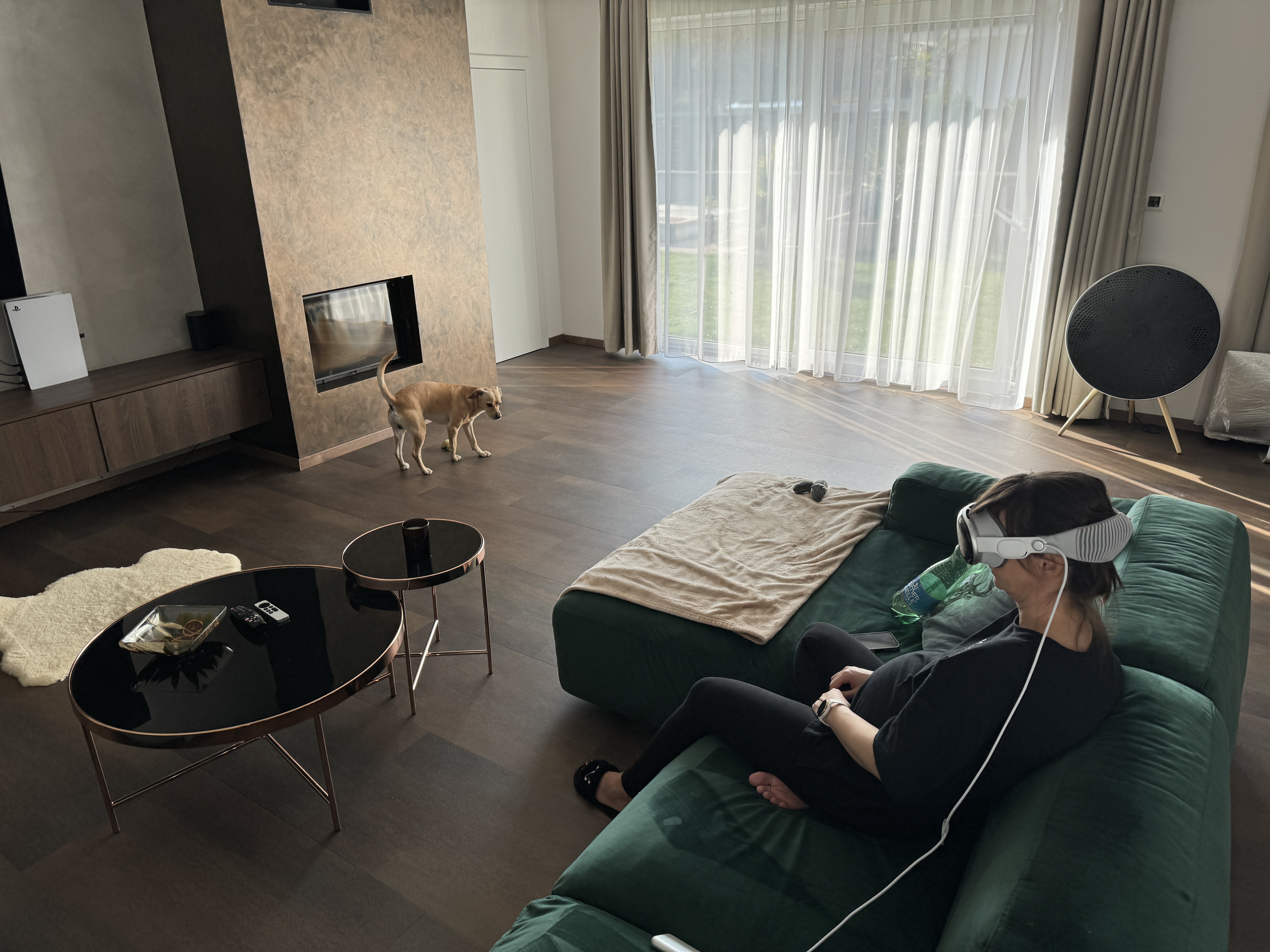 person wearing vr headset living room