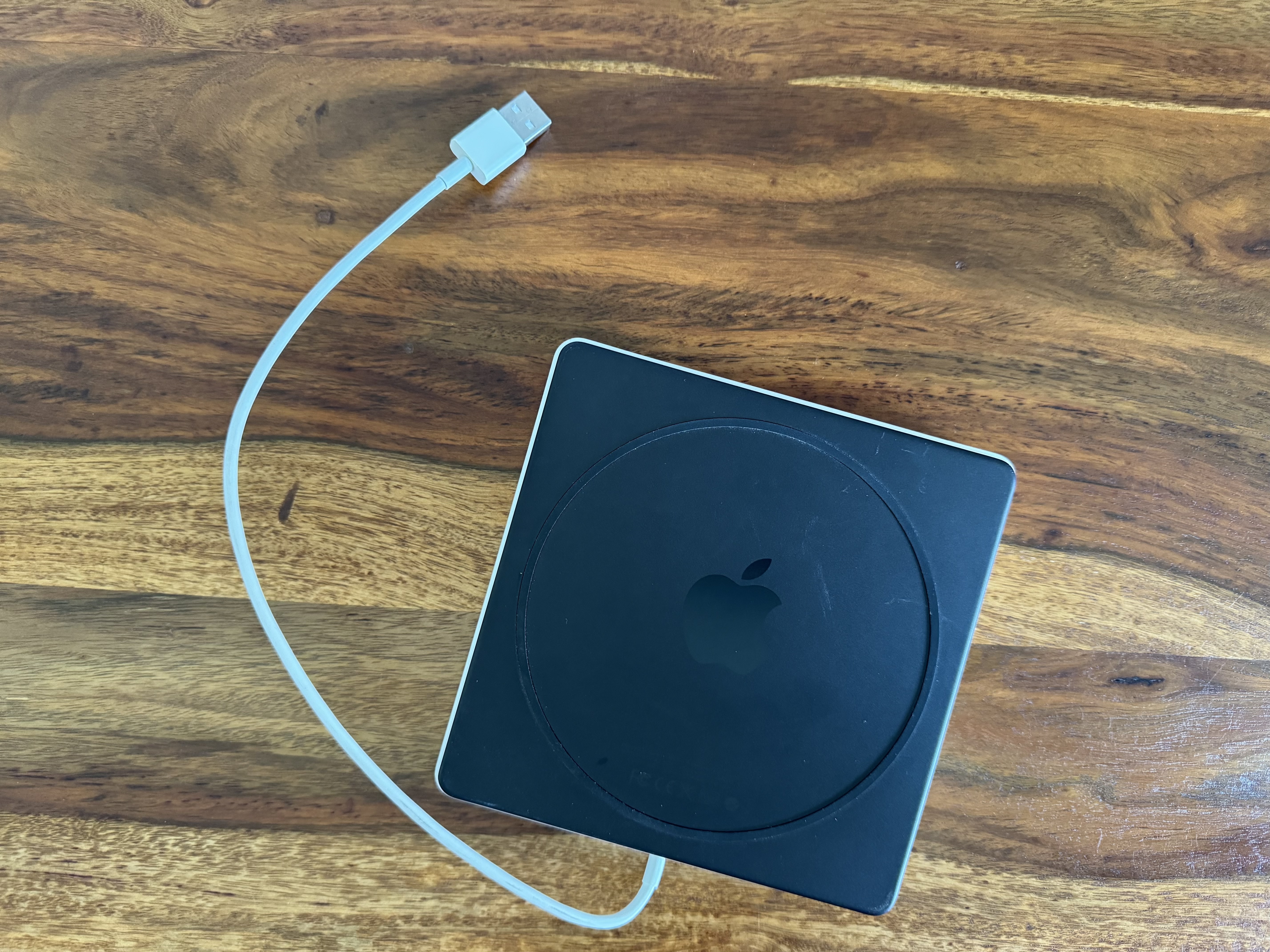 apple charger on wood