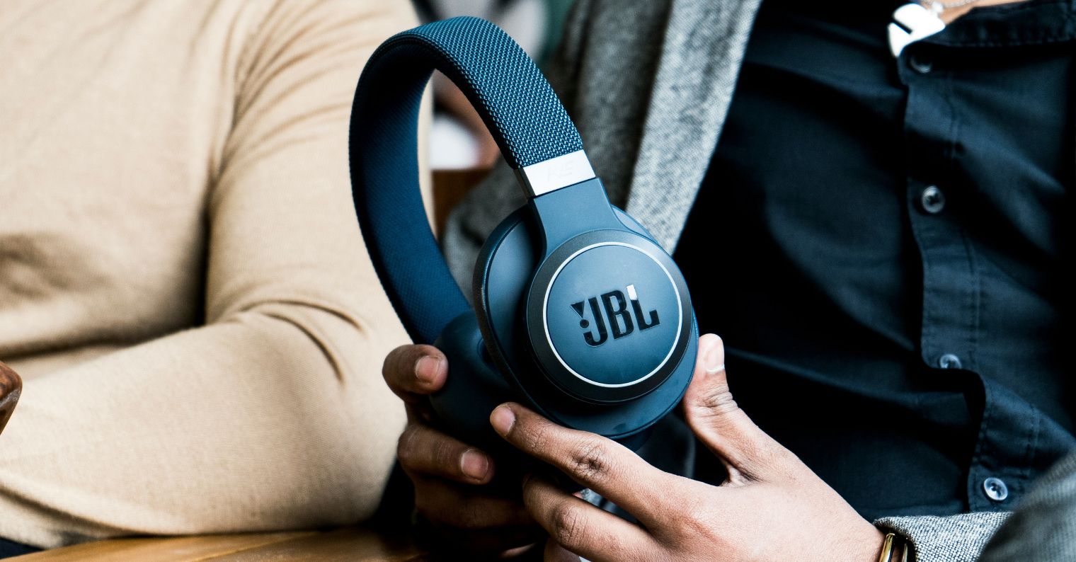 holding jbl headphones