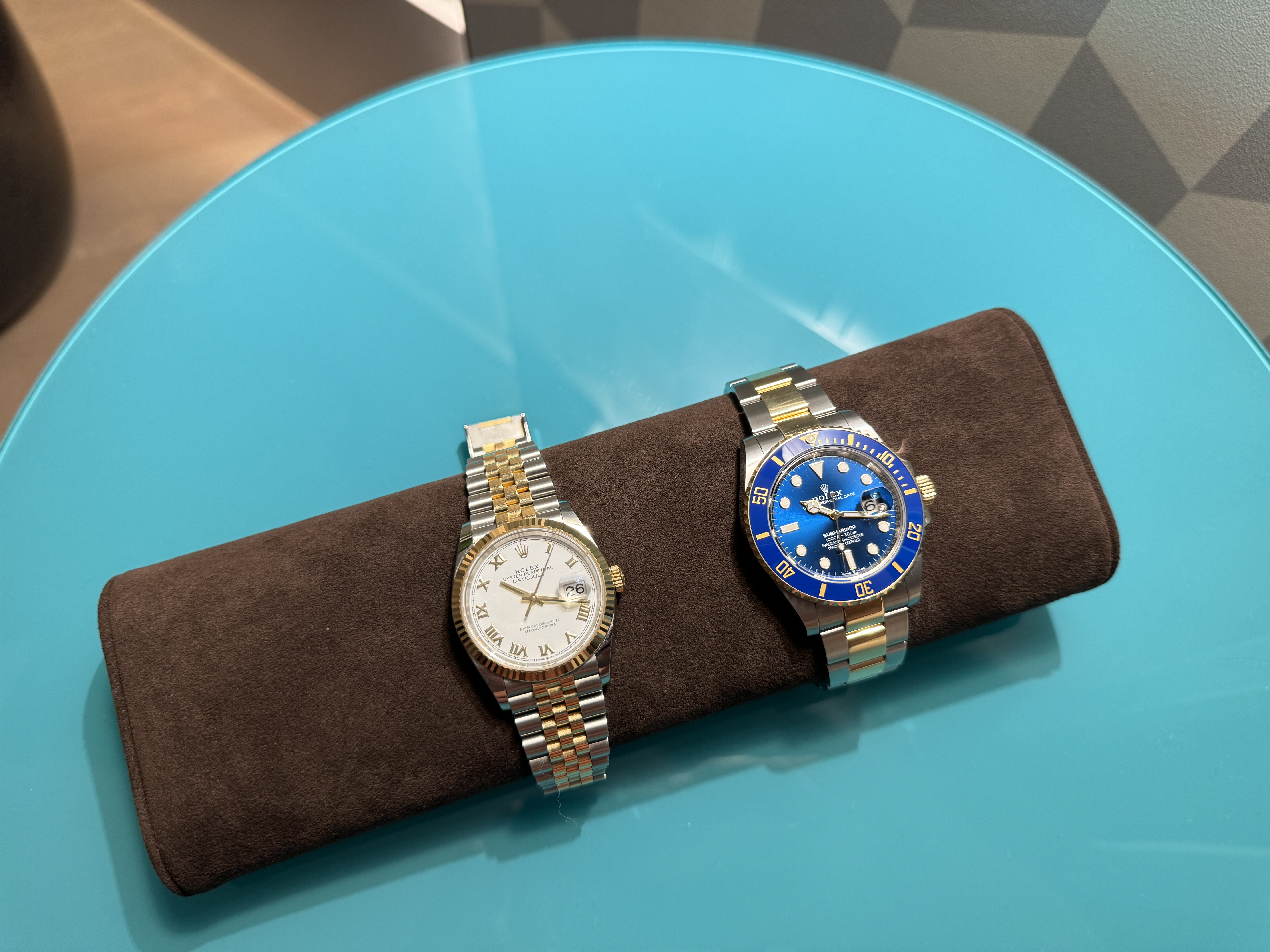 two watches on table