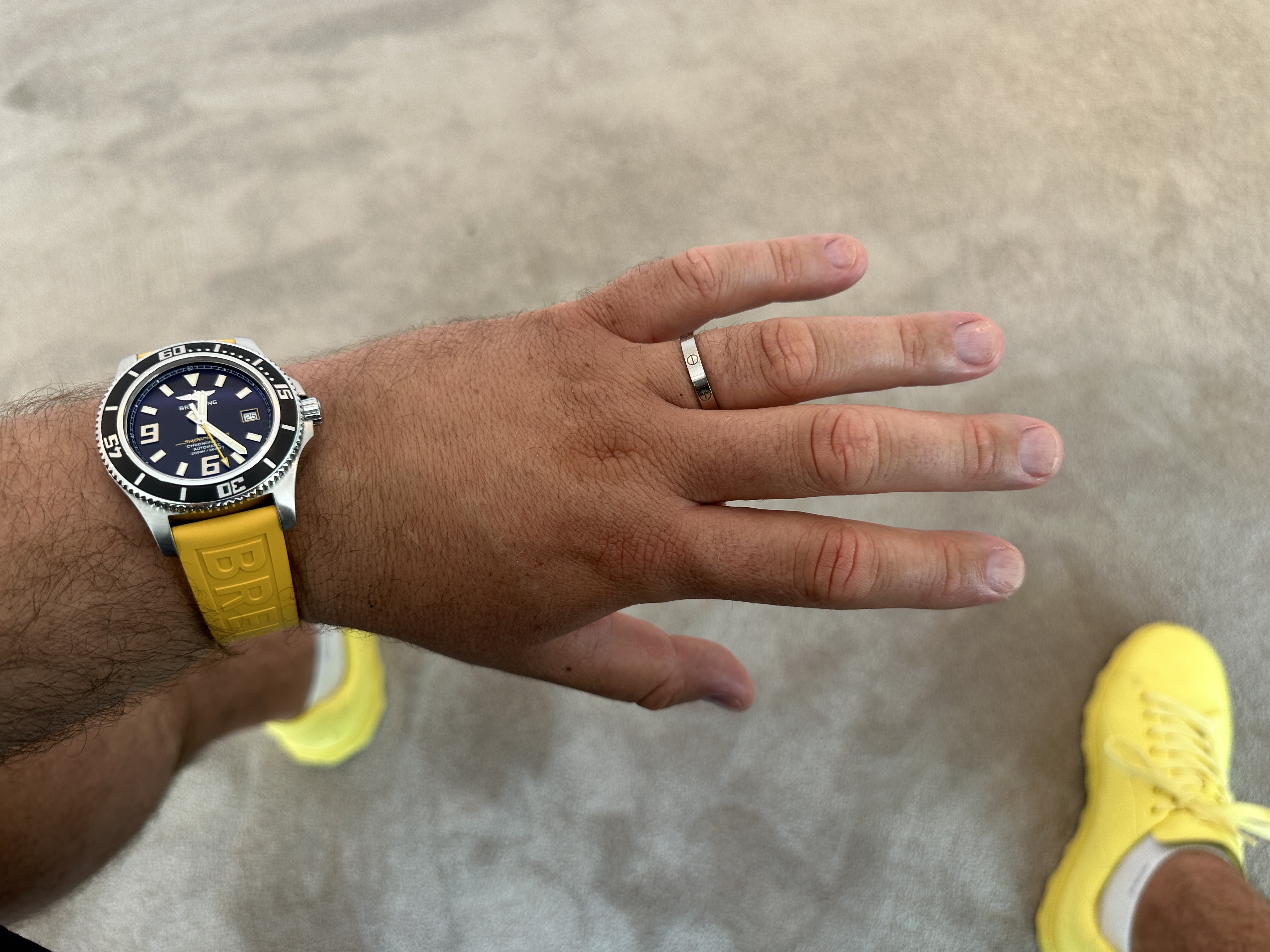yellow strap watch on hand
