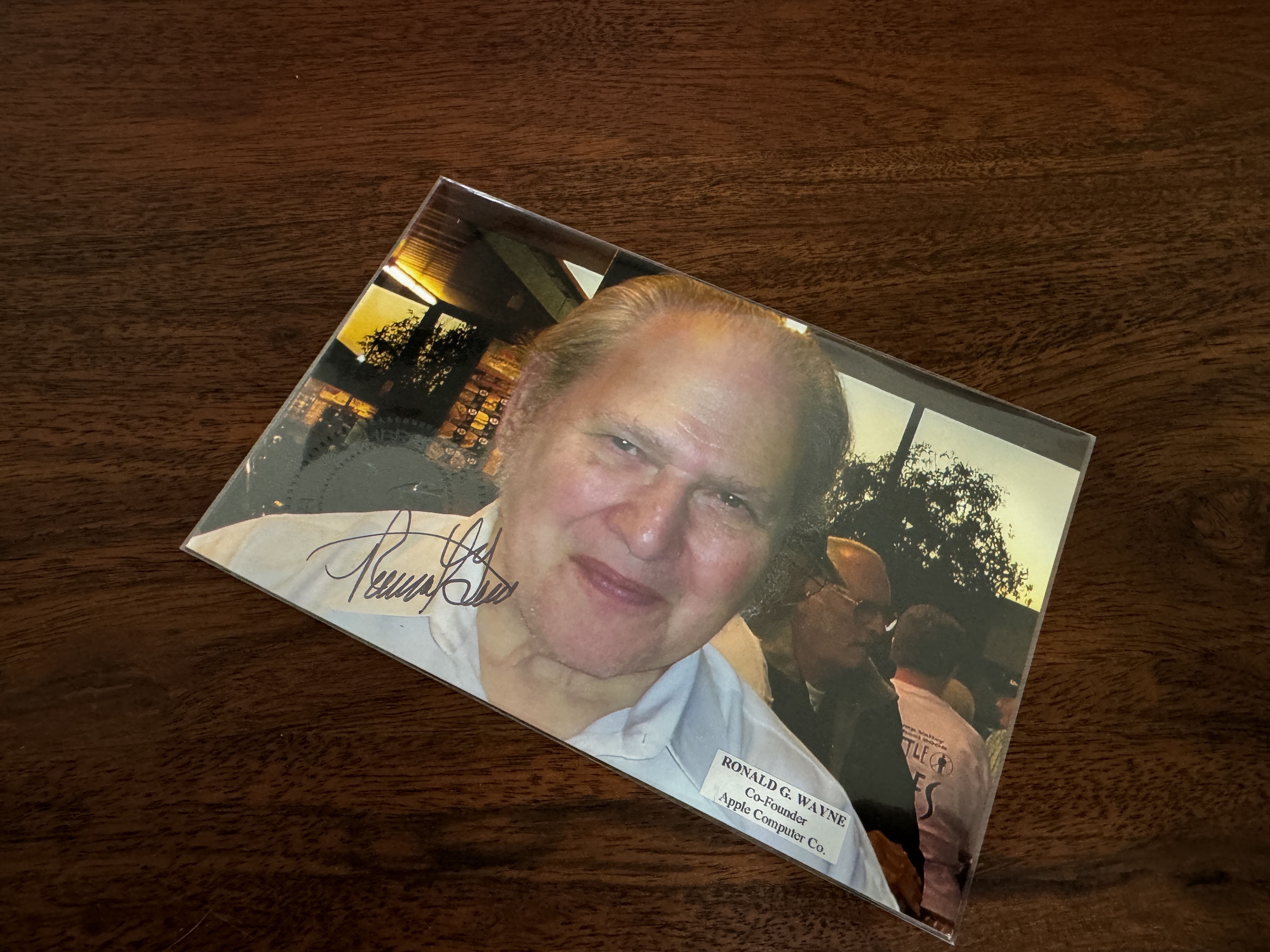 autographed photo on wooden table