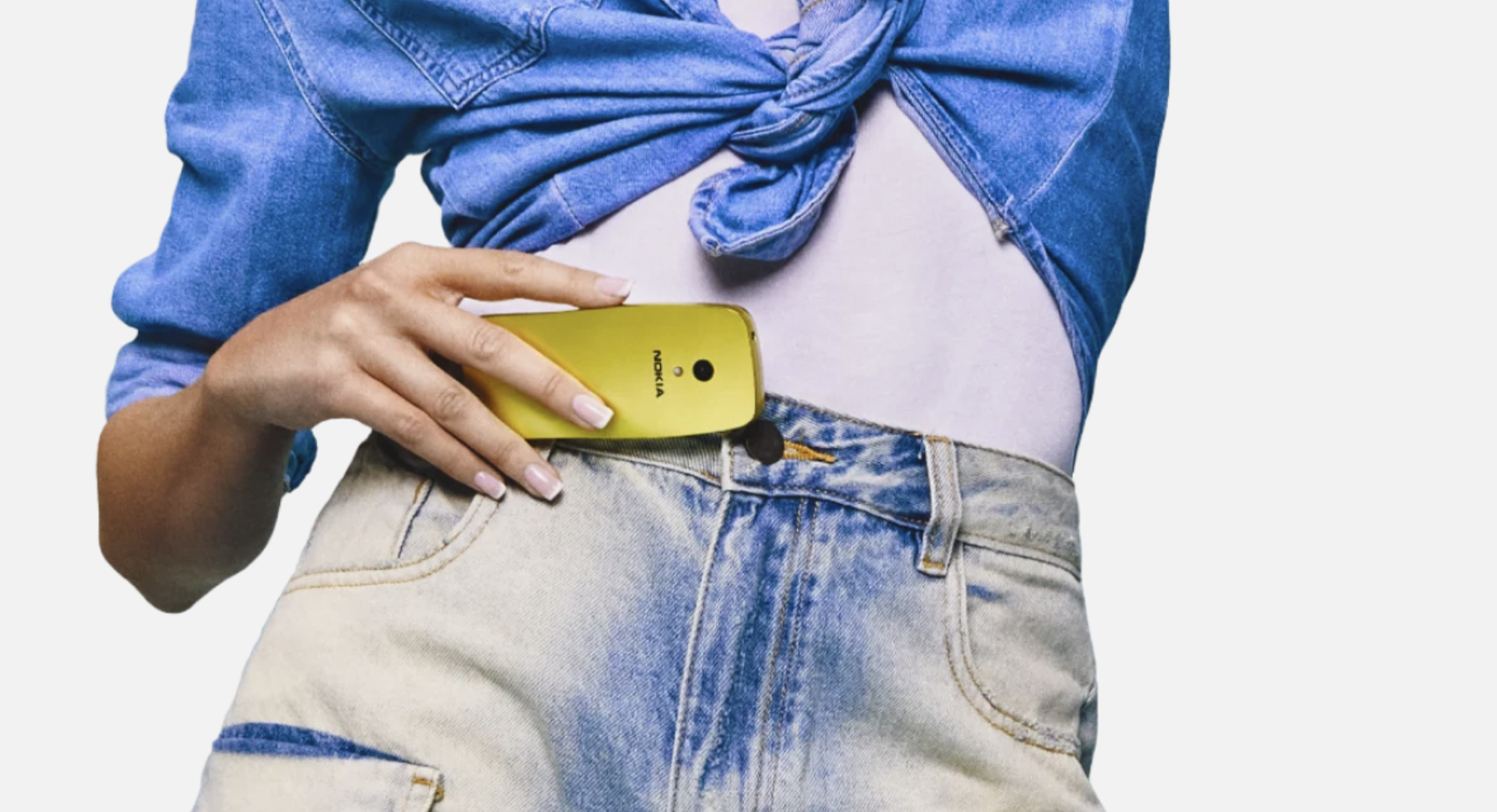 denim outfit with yellow phone