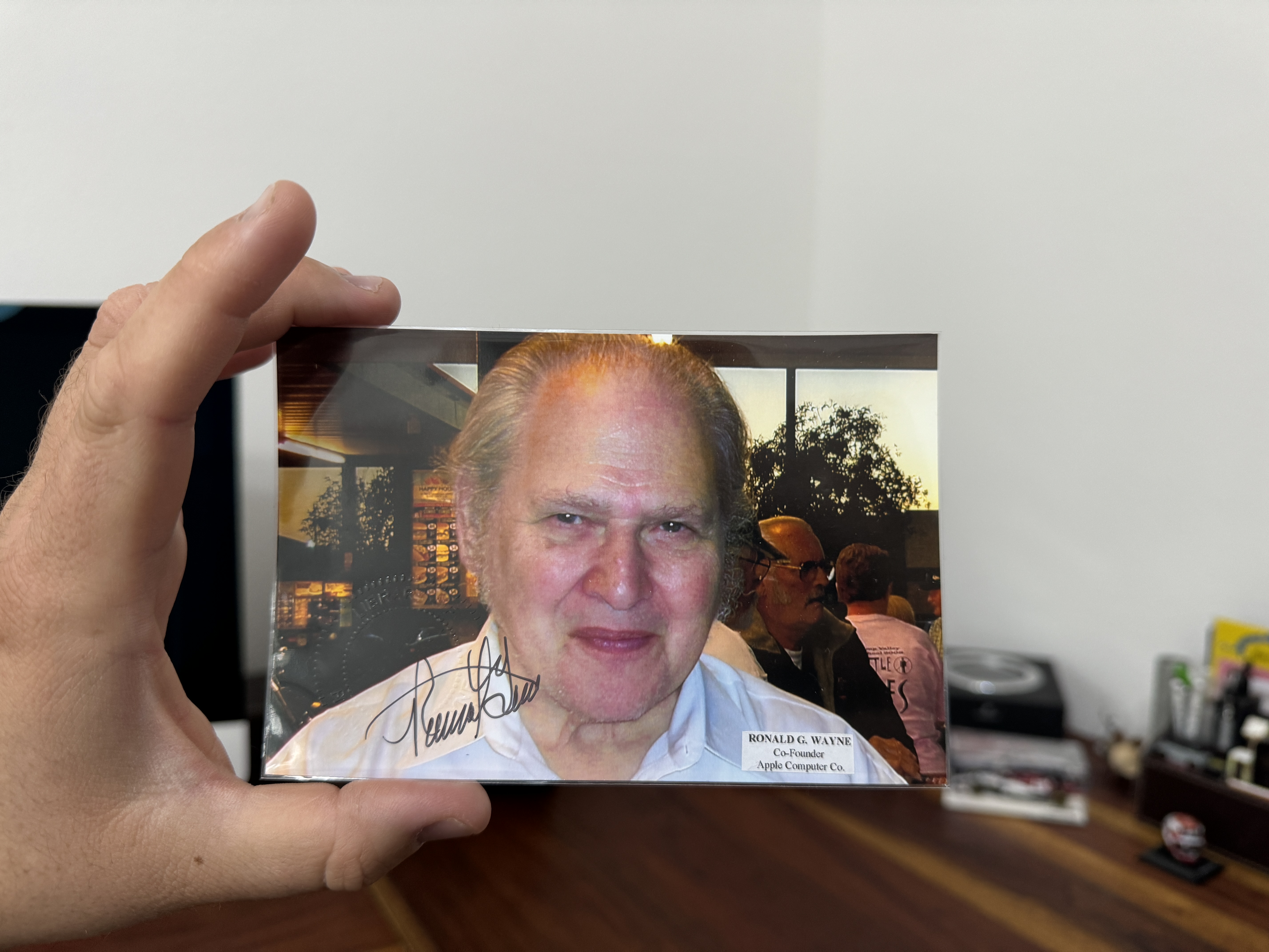 hand holding autographed photo