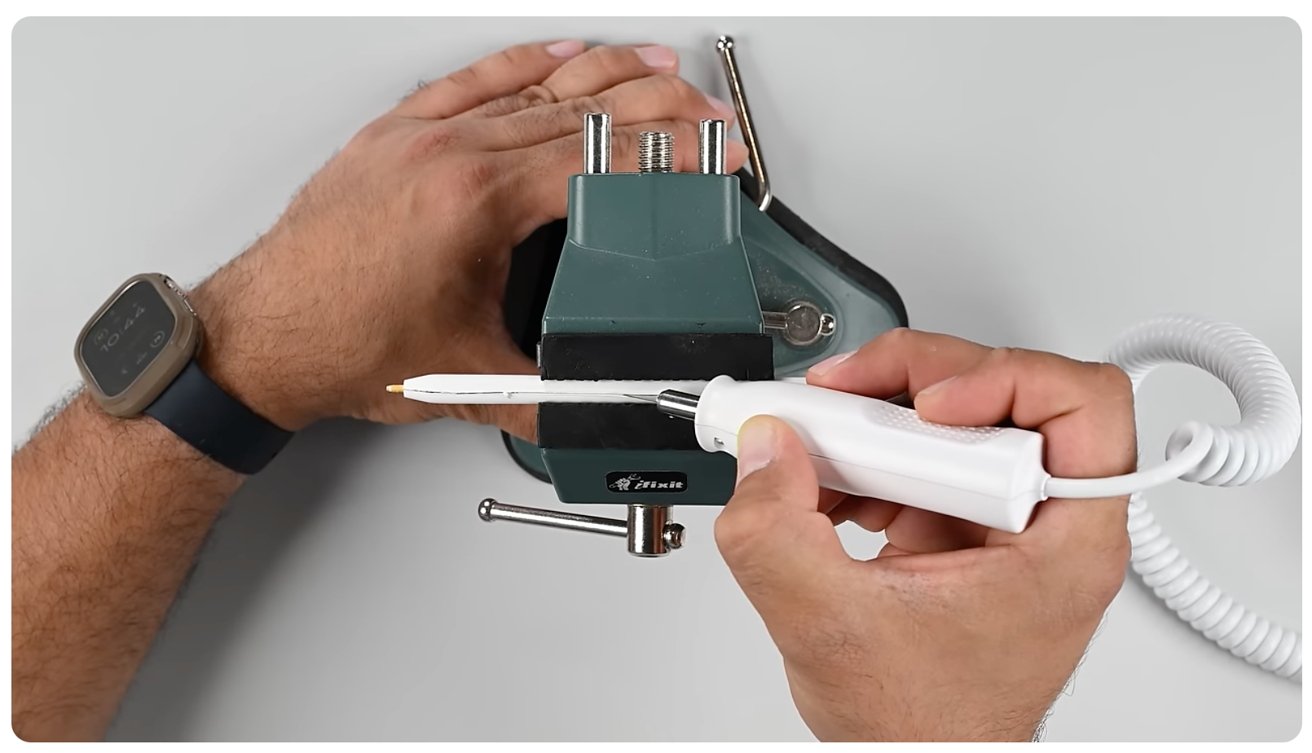 hand holding soldering tool