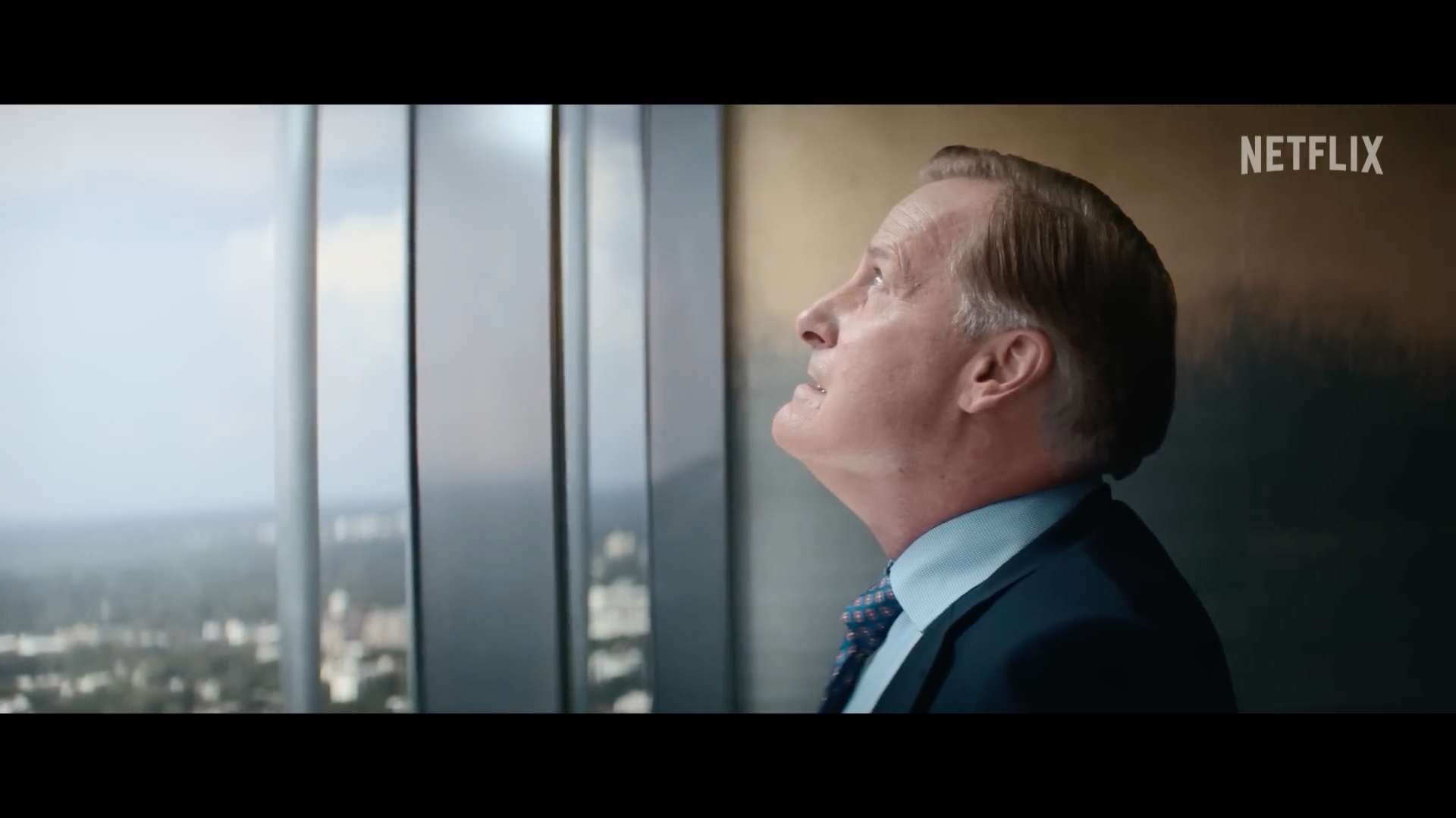 man looking out window man looking out window