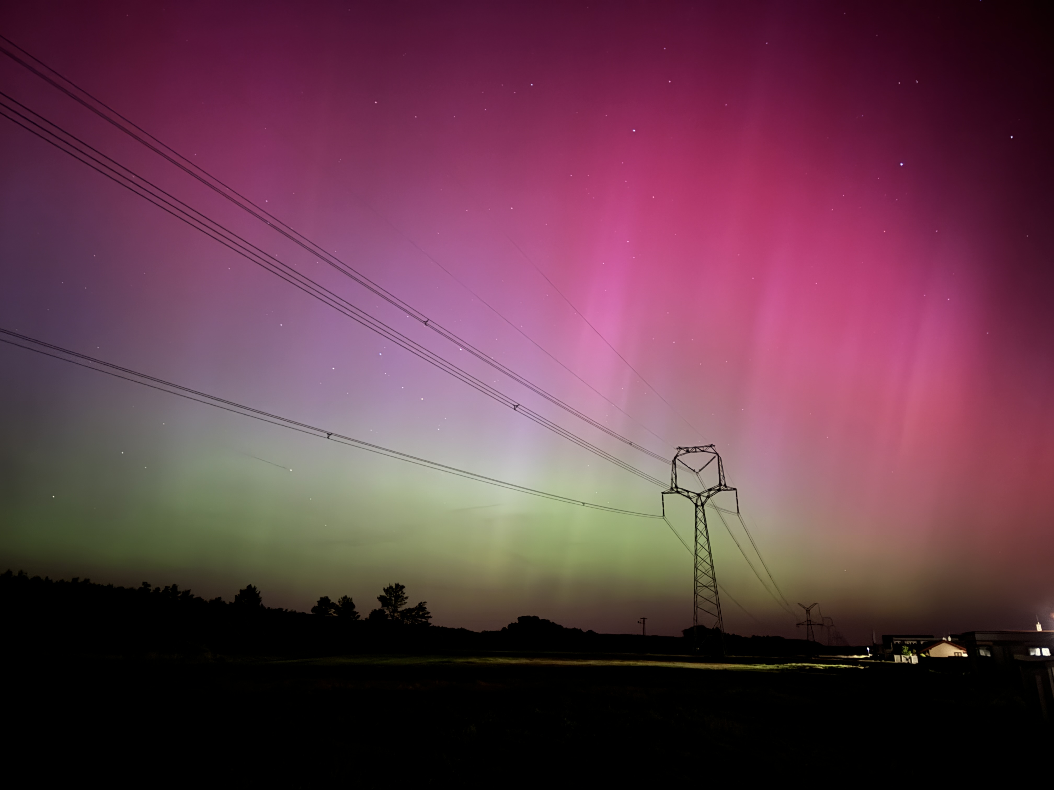 northern lights with power lines