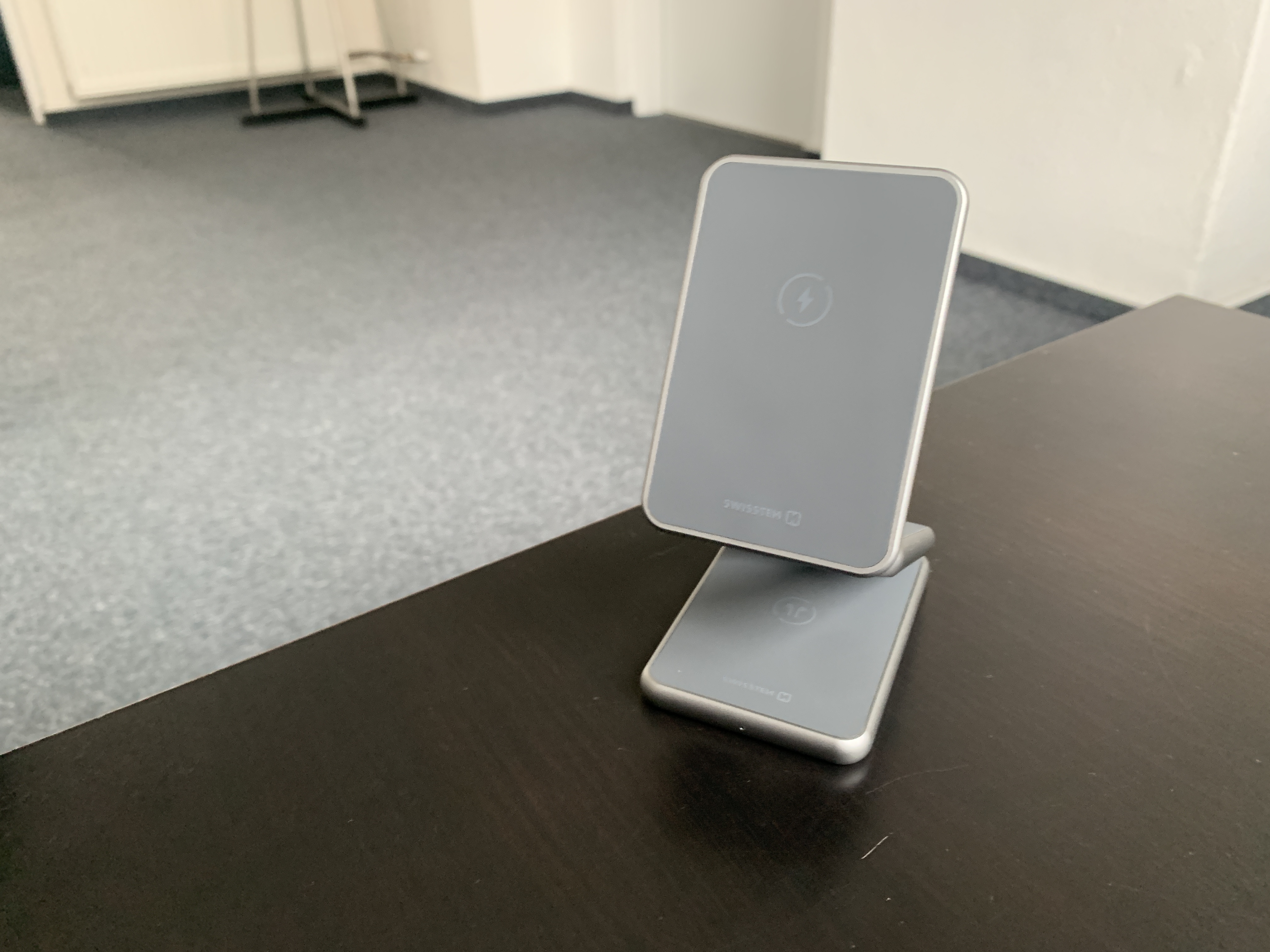 phone stand on dark desk
