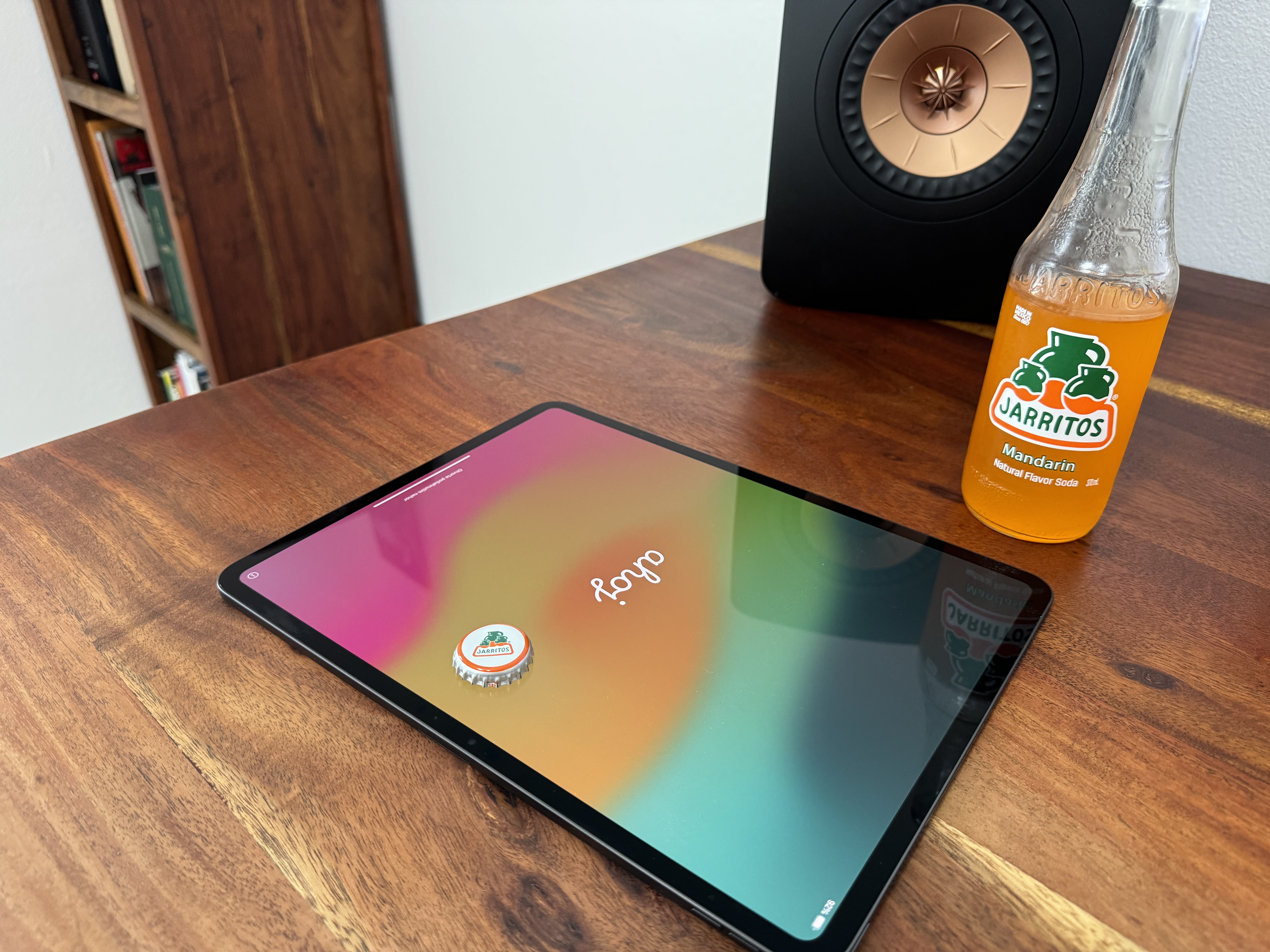 tablet with jarritos and speaker on desk