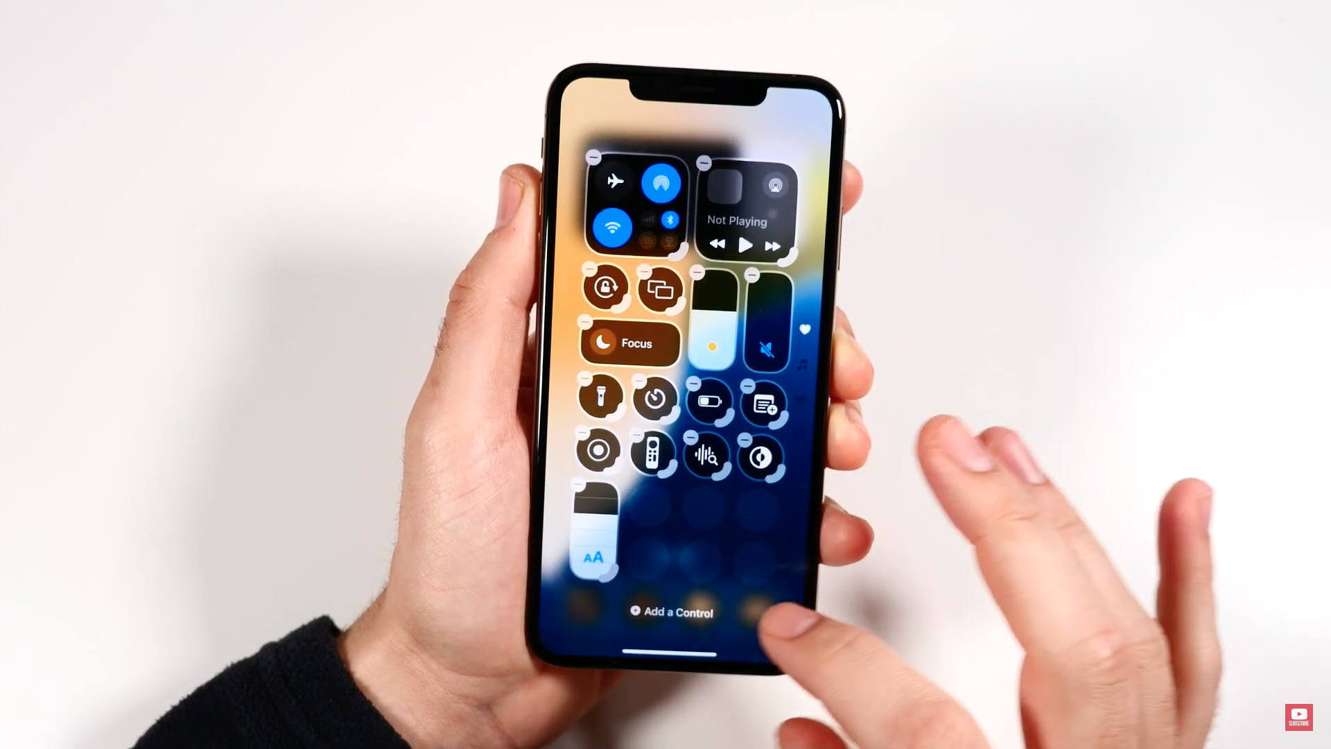 hand holding smartphone control center