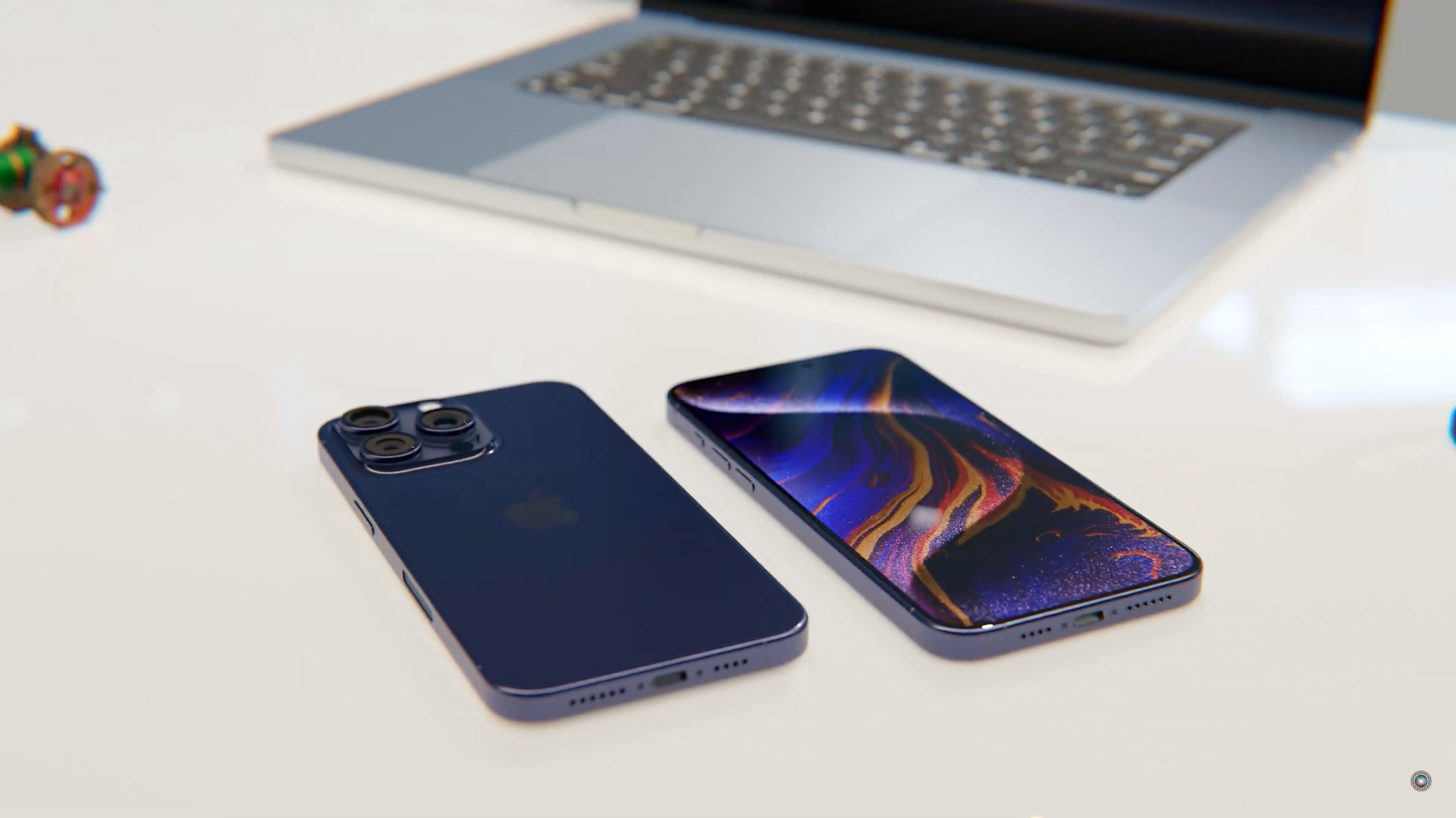 smartphones and laptop on desk