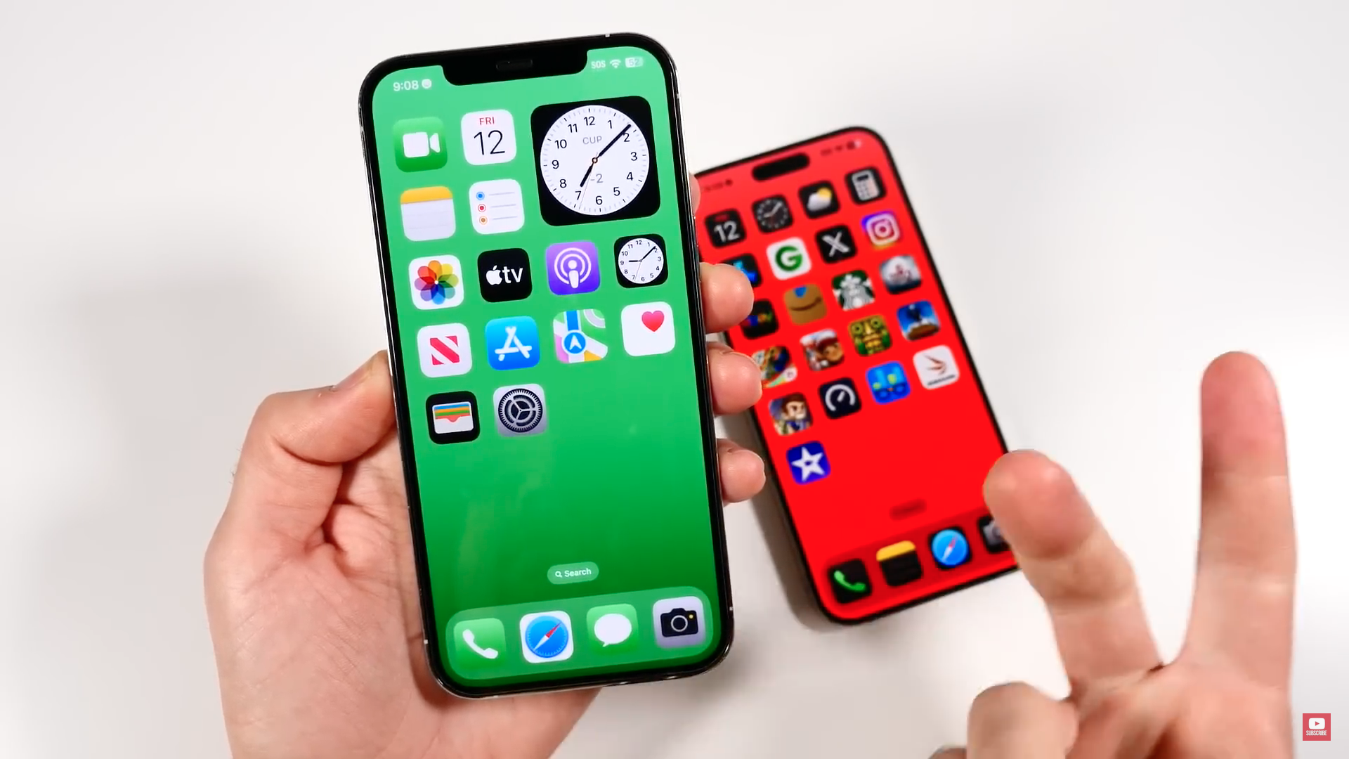 hand holding two iphones