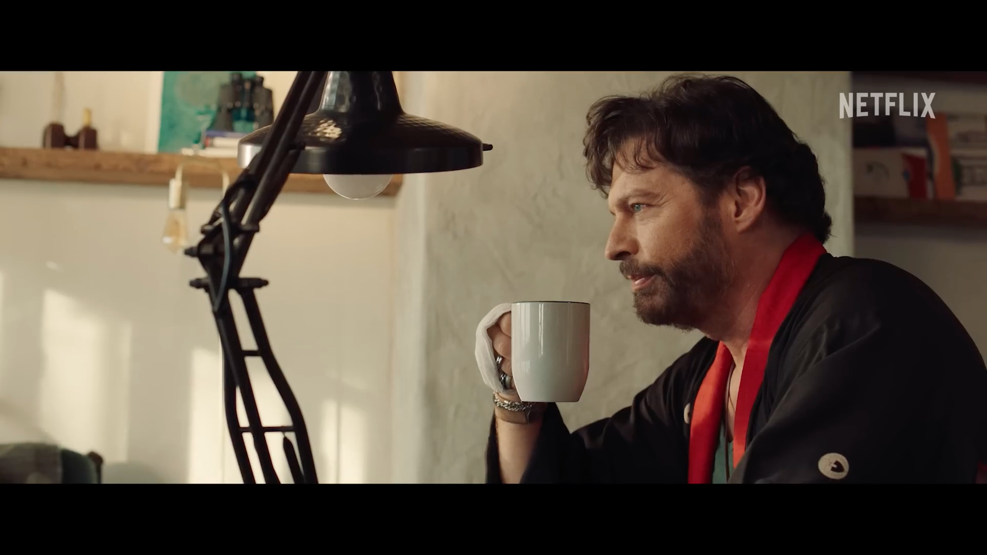 man drinking coffee netflix