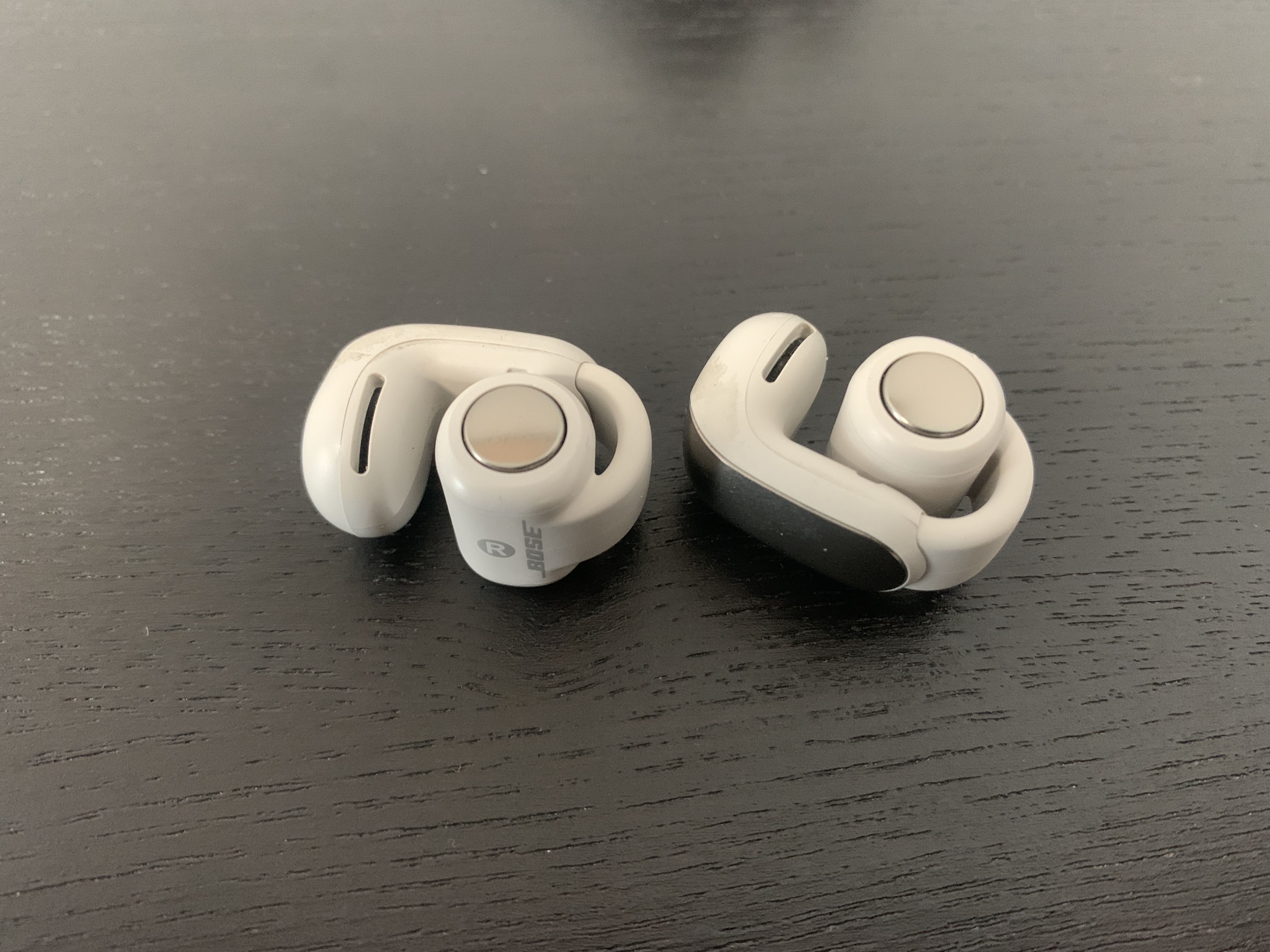 bose earbuds pair on table