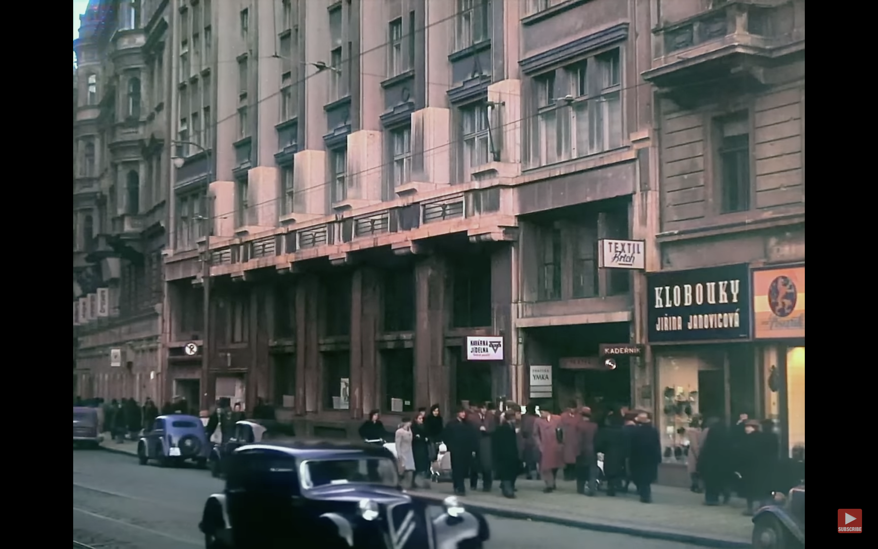 city street scene with cars and pedestrians