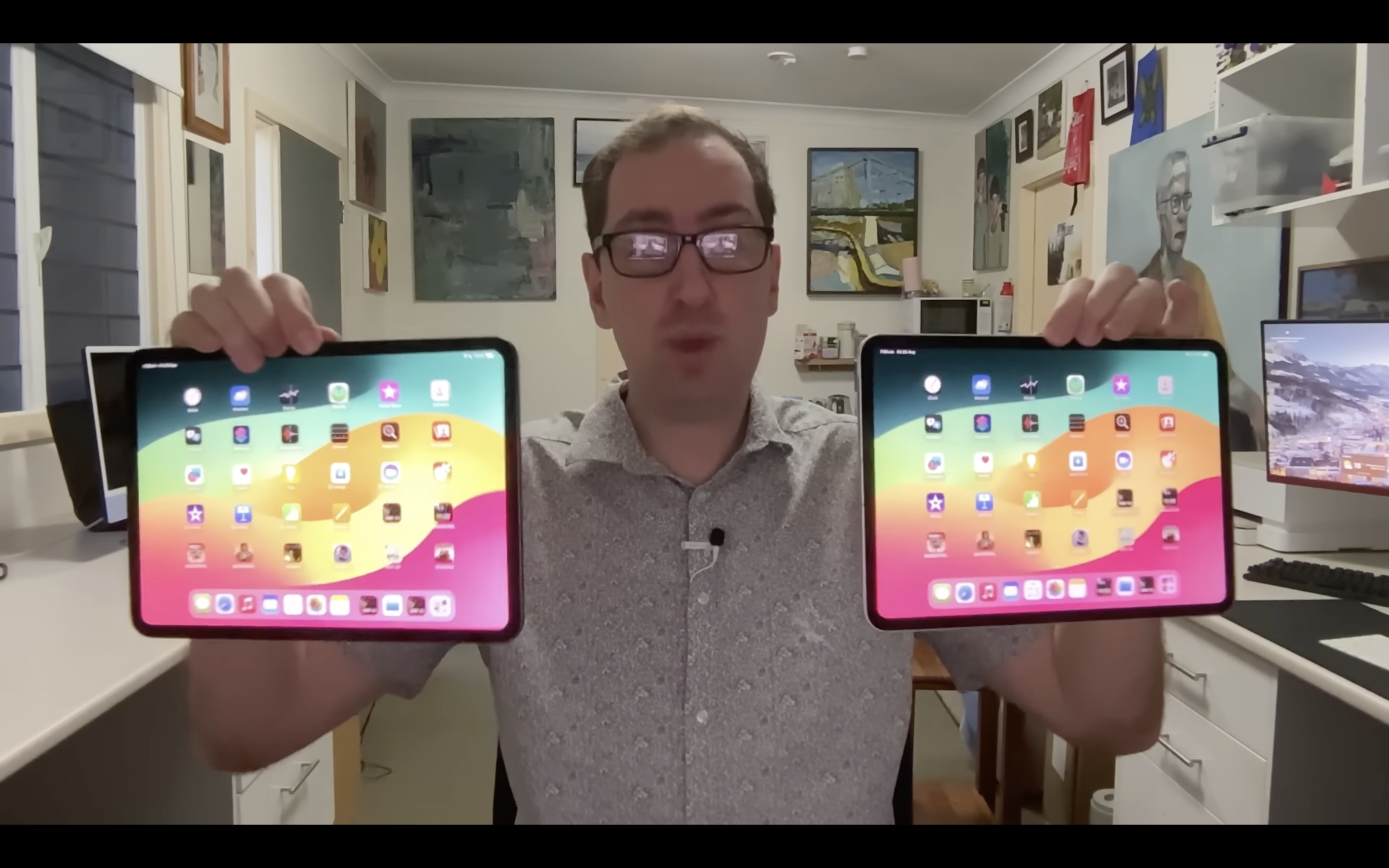 man holding ipads