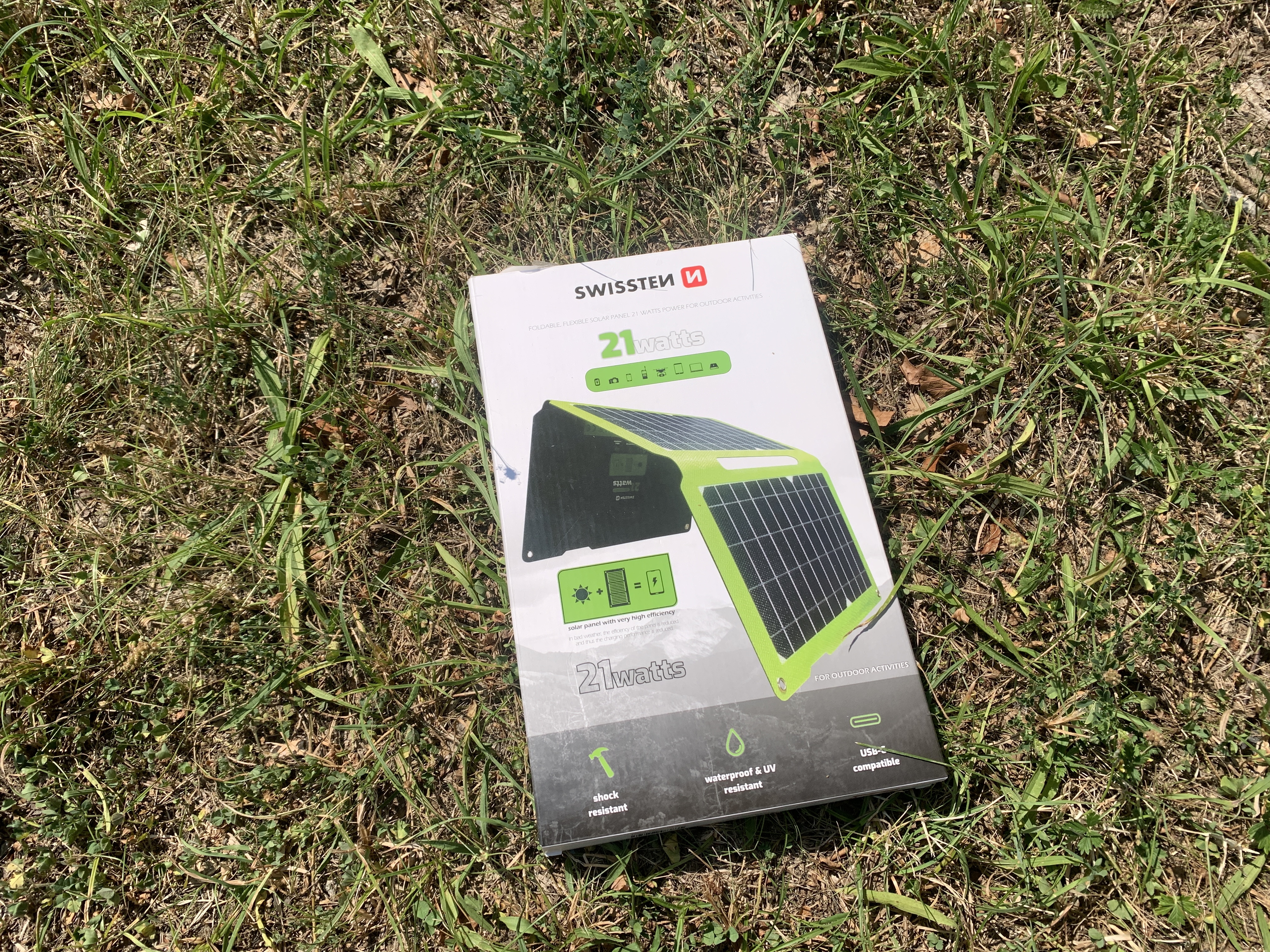 swissten solar panel packaging on grass