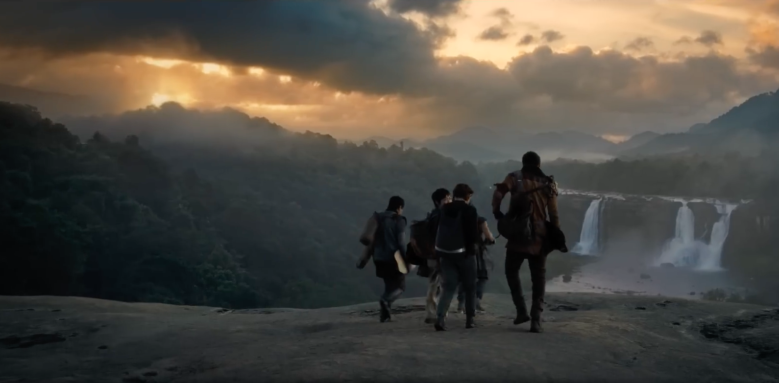 adventurers overlooking waterfall
