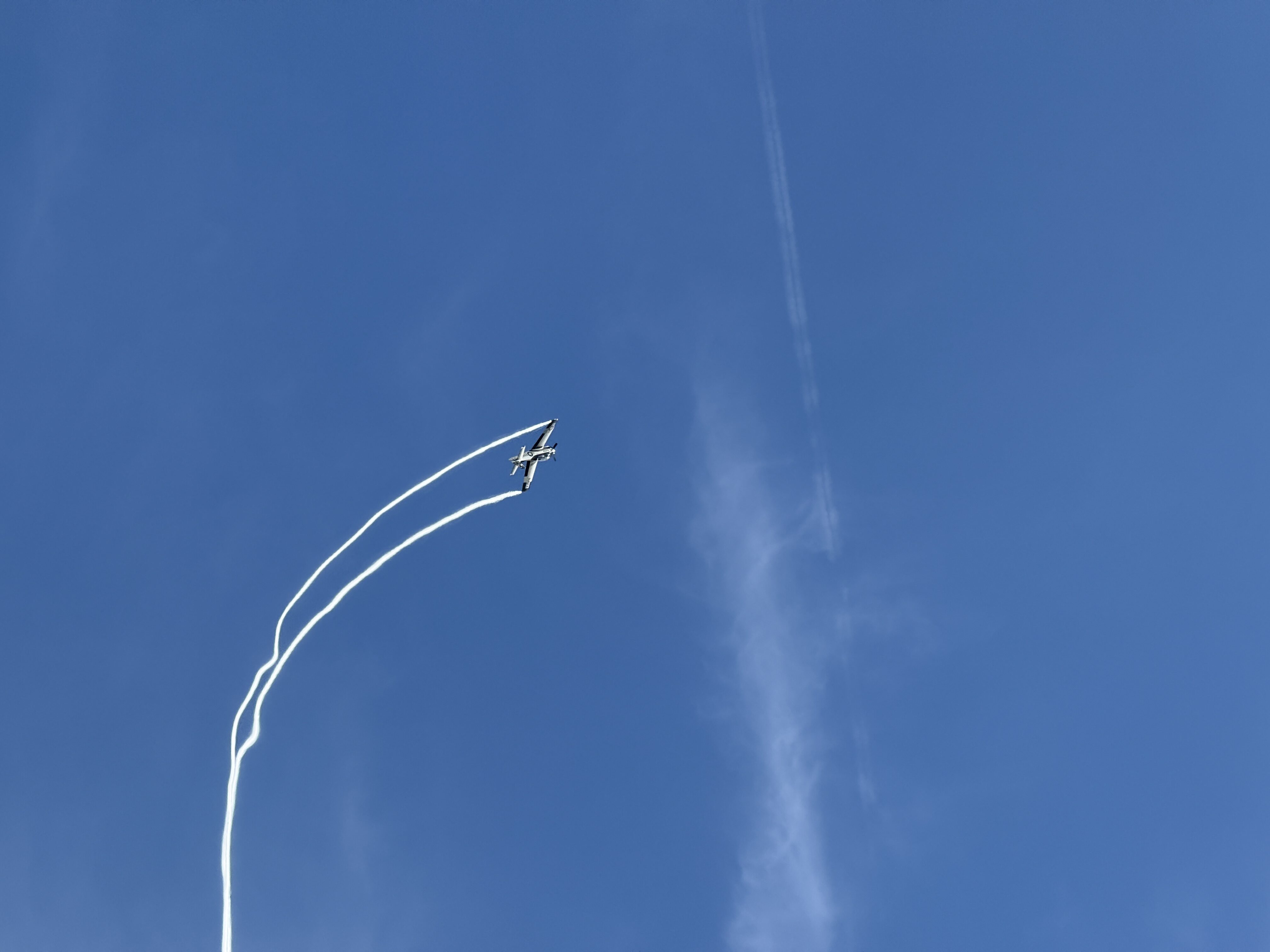 airplane with smoke trails