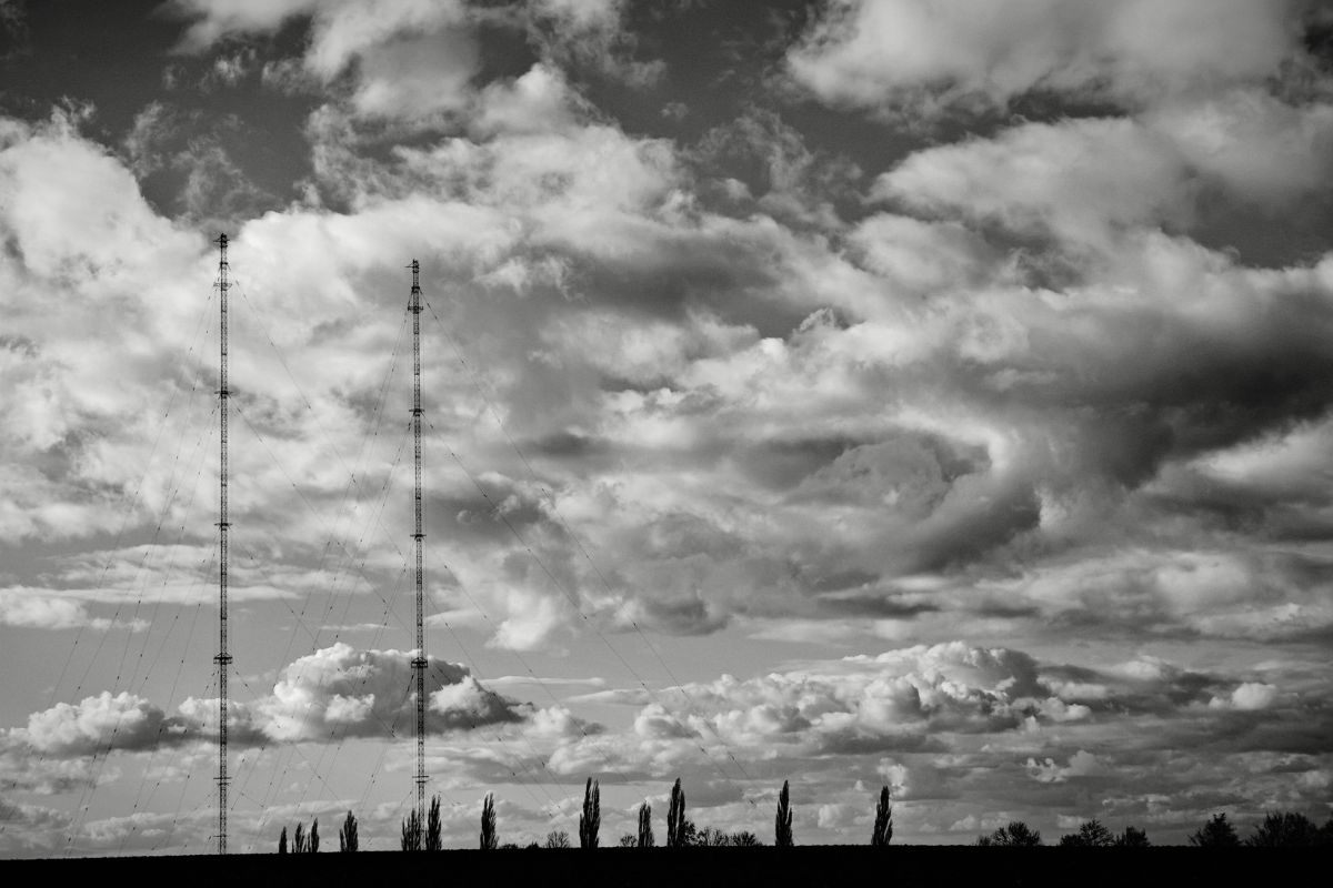 black and white clouds radio towers