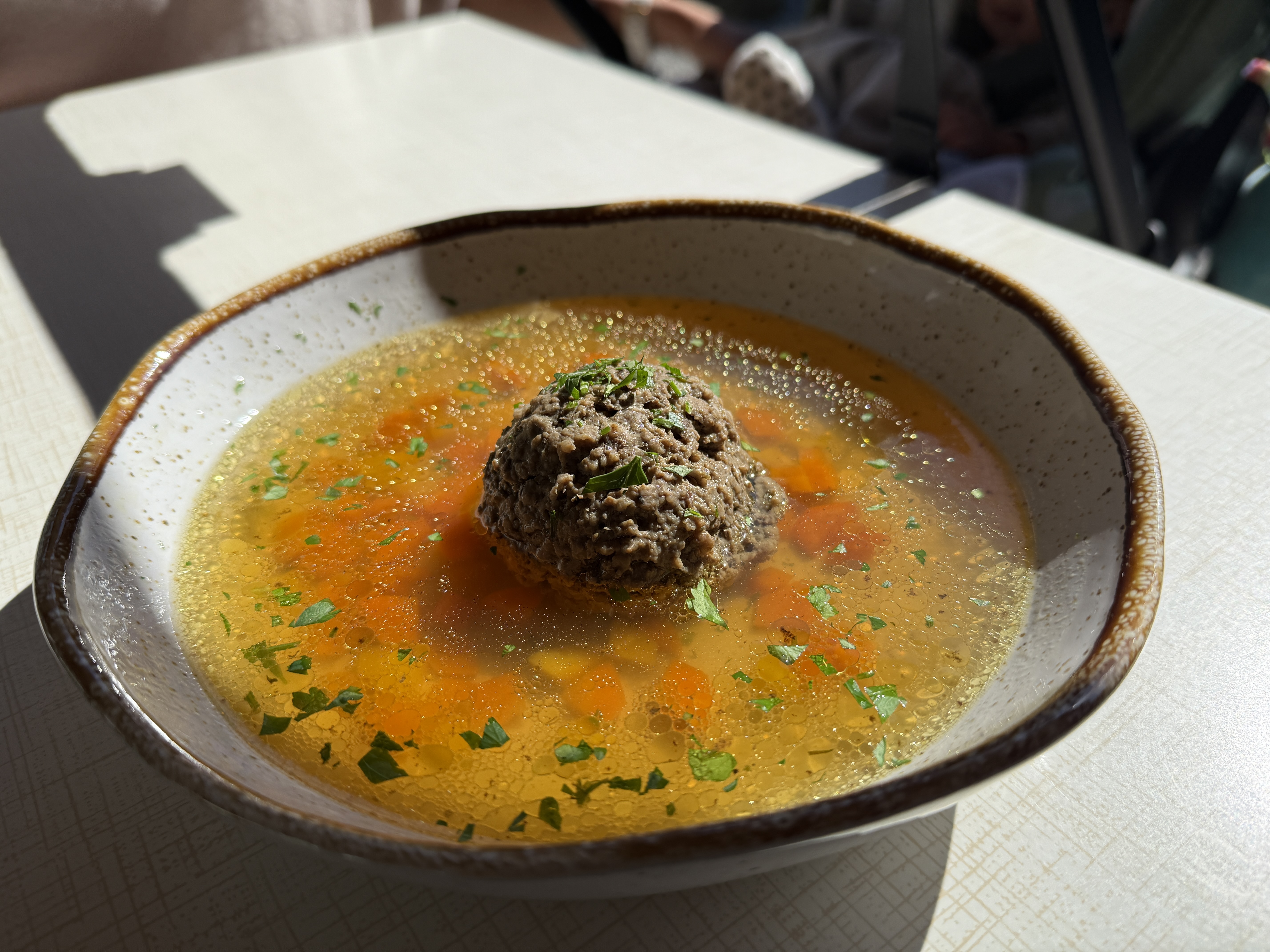 bowl of soup with dumpling