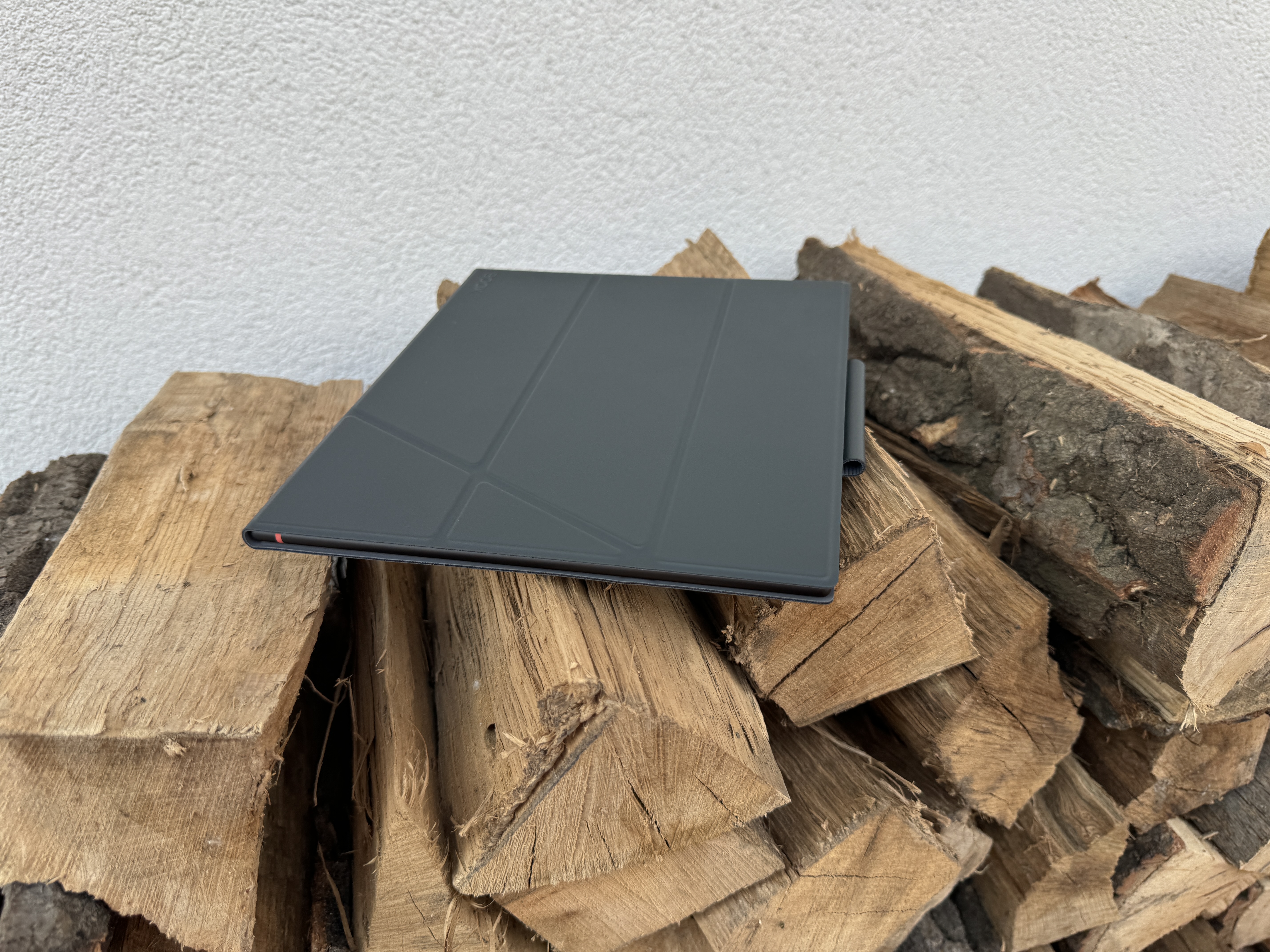 closed ebook reader on wood