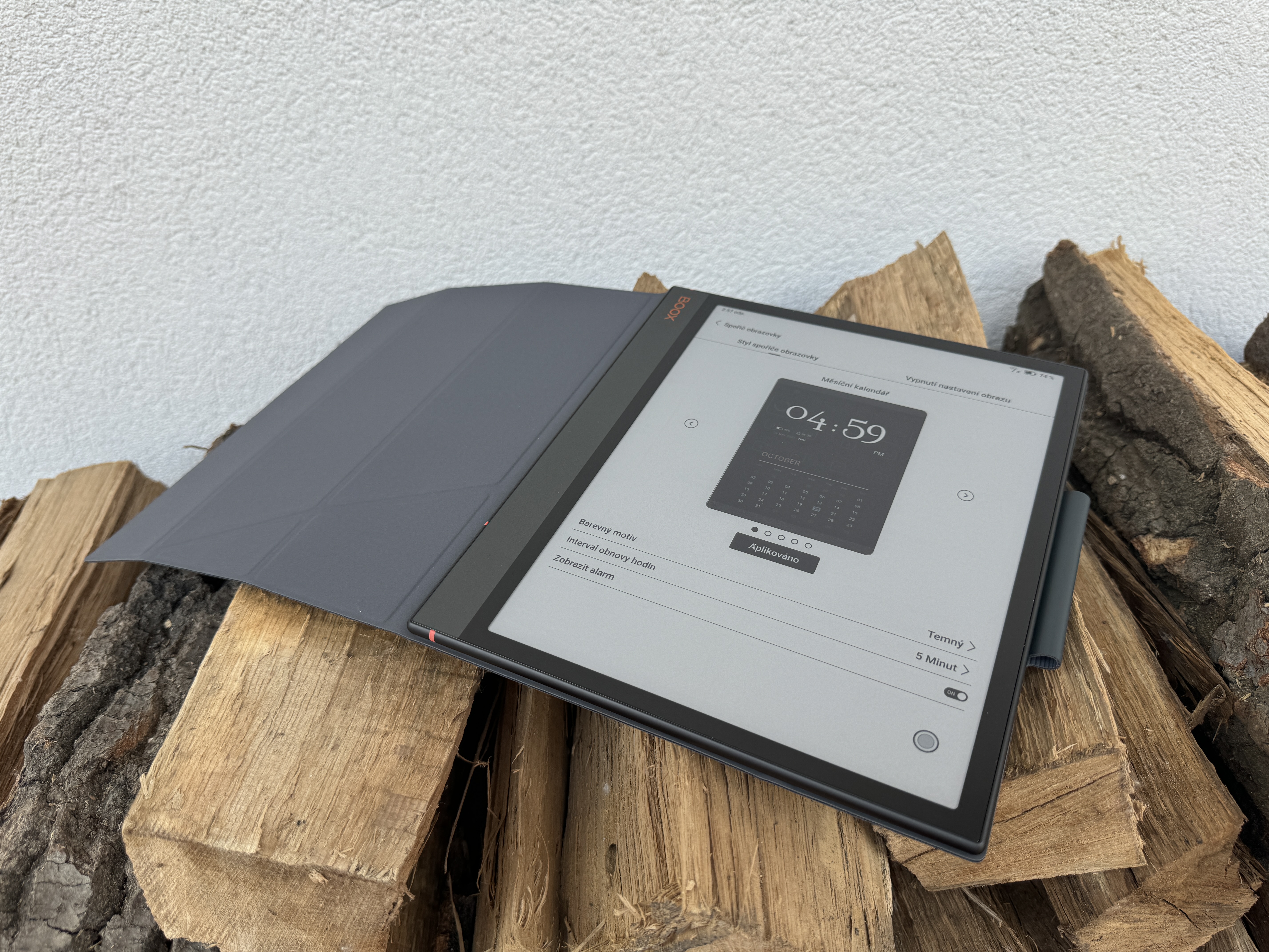 ebook reader on wooden logs