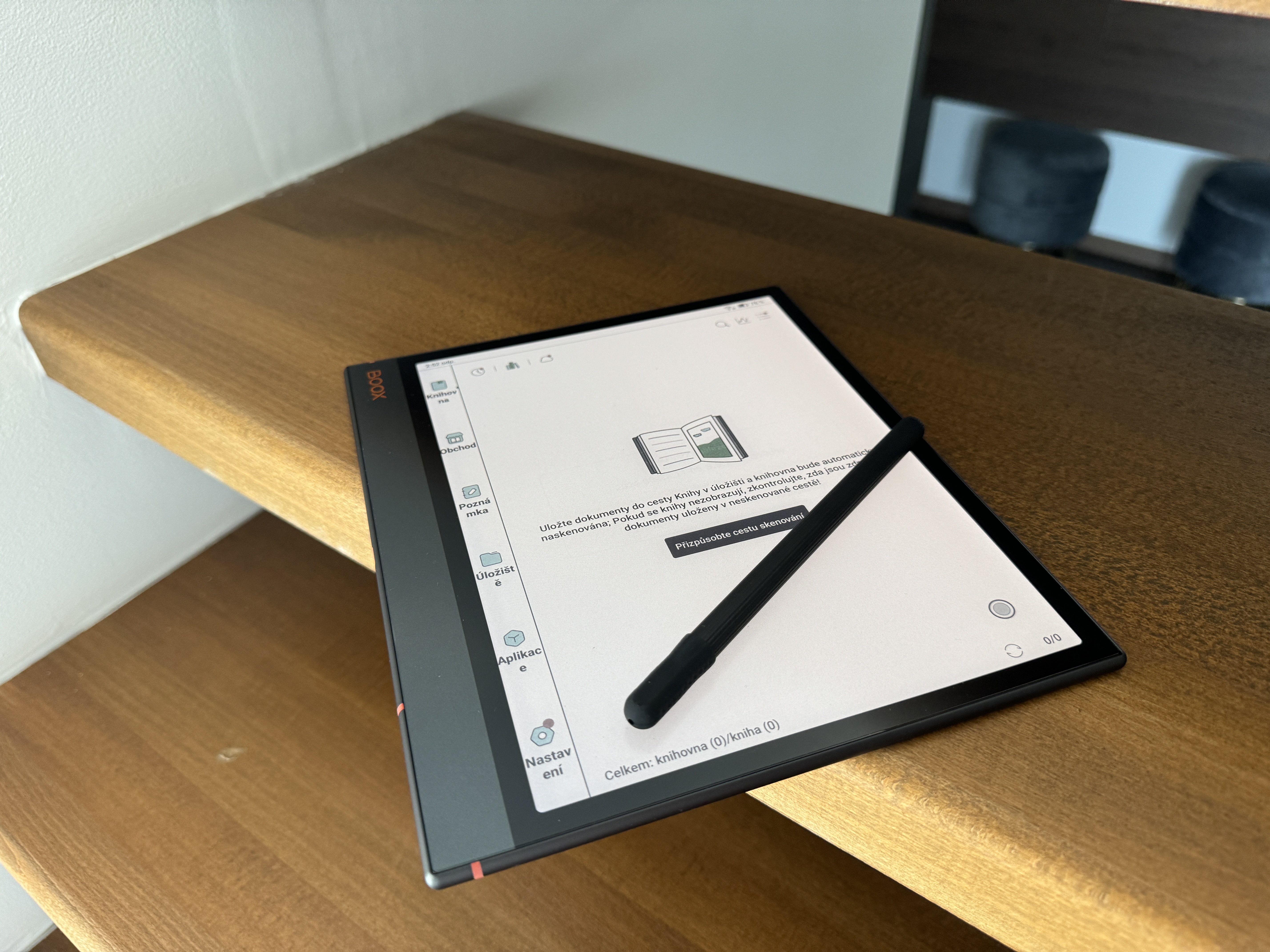 ebook reader with stylus on stairs