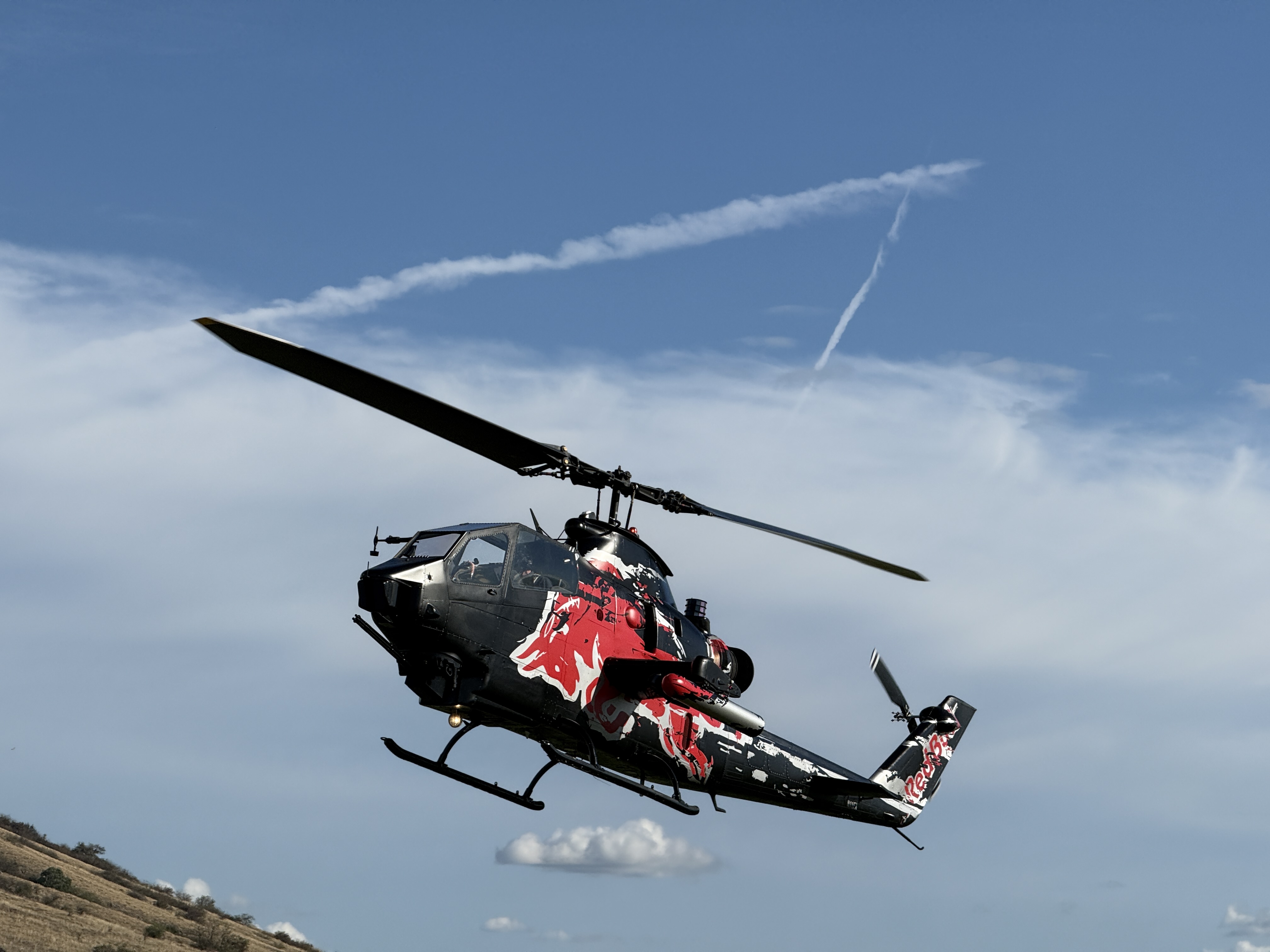 helicopter hovering clouds